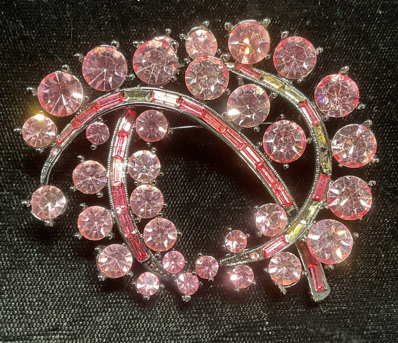 XL Silver Tone Pink Crystal Brooch 2.5 In W: Silver tone pink crystal brooch. Measures approx 2 x 2.5 inches. Some wear including scratching. Some crystals need replacement. Jewelry, costume jewelry, estate jewelry, fashion jewelry, cocktail jew