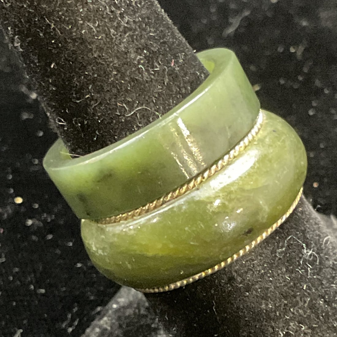Lot 2 Vintage Nephrite Semiprecious Rings: Lot of 2 Vintage rings. Silver tone and green stone band and solid green stone band rings. Appear to be nephrite. Larger ring size 7. Some wear including scratching. Jewelry, costume jewelry, estate j