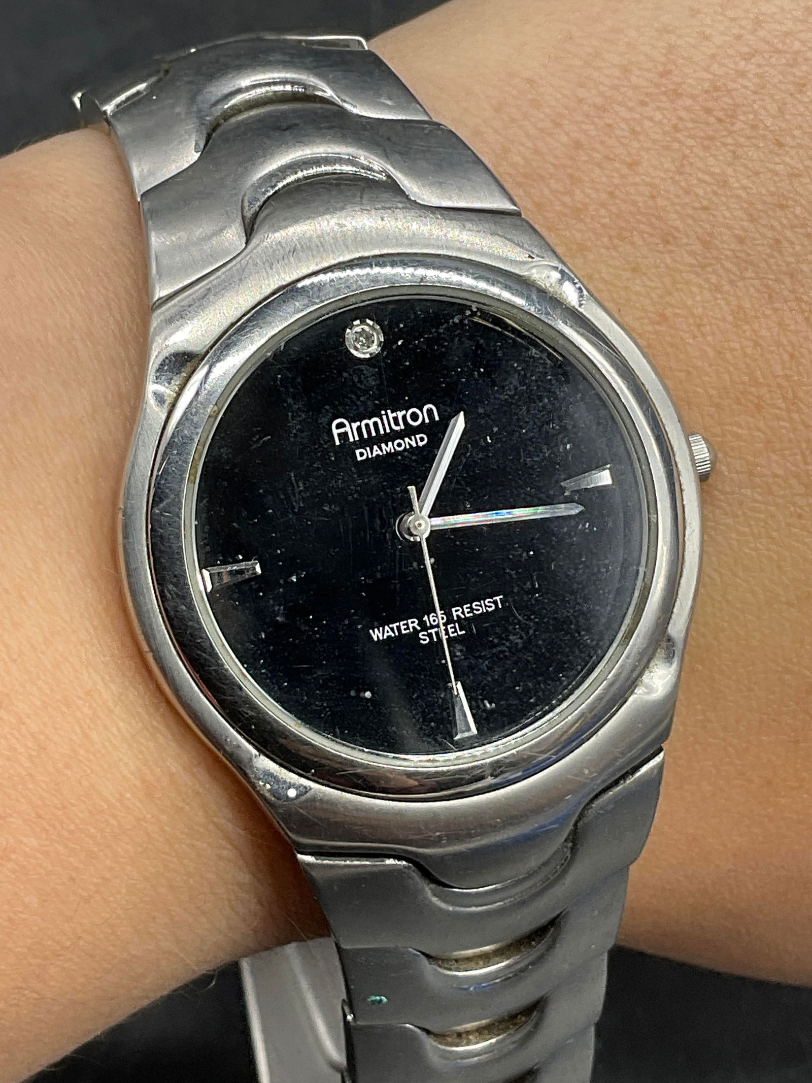 ARMITRON Stainless Steel Wristwatch: ARMITRON Stainless Steel Wristwatch. Obverse reads ARMITRON DIAMOND. Reverse reads All Stainless Steel. Clasp reads Stainless Steel. Diameter measures approx. 2.75 inches. Not tested for function. Sur
