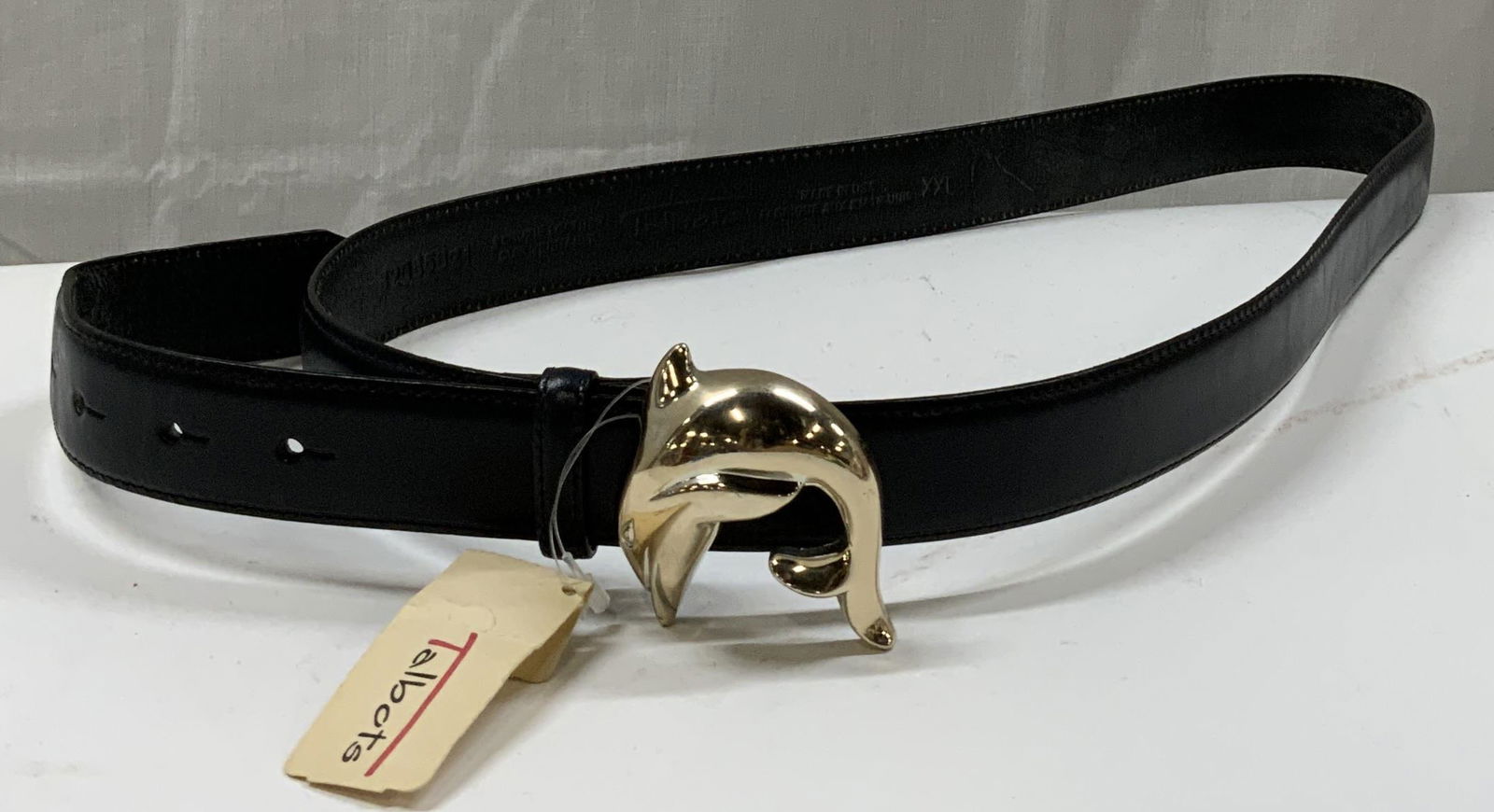 Talbots Black Leather Dolphin Buckle Belt: Talbots Black Leather Dolphin Buckle Belt. Genuine black leather belt with a dolphin silver buckle. Comes with original Talbots tag on belt. Stamped with made in USA. Sizing on tag: XXL. Visible fadin