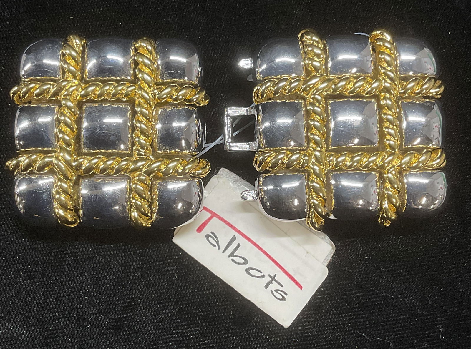 2 Piece Paquette Silver & Gold Tn Belt Buckle NWT: Two piece Paquette belt buckle. Silver and gold tone square shaped with cable pattern. Signed on underside. Measure approx 1.5 x 1.5 inches each. New with tag. Some wear including scratching observed.