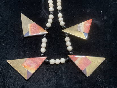 Vtg White Stone Brass Coral Pendant Necklace: Vintage white and black stone beaded necklace with brass and coral inlaid pendants. Drop length approx 9 inches. Some wear including scratching and chipping observed. Jewelry, costume jewelry, estate