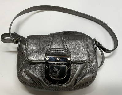 Michael Kors Metallic Leather Crossbody Bag: Michael Kors Metallic Leather Crossbody Bag Metallic crossbody bag with a lock detail in the front. Pockets in the interior of the bag, with ample space. No visible staining or blemishes. Some minor s