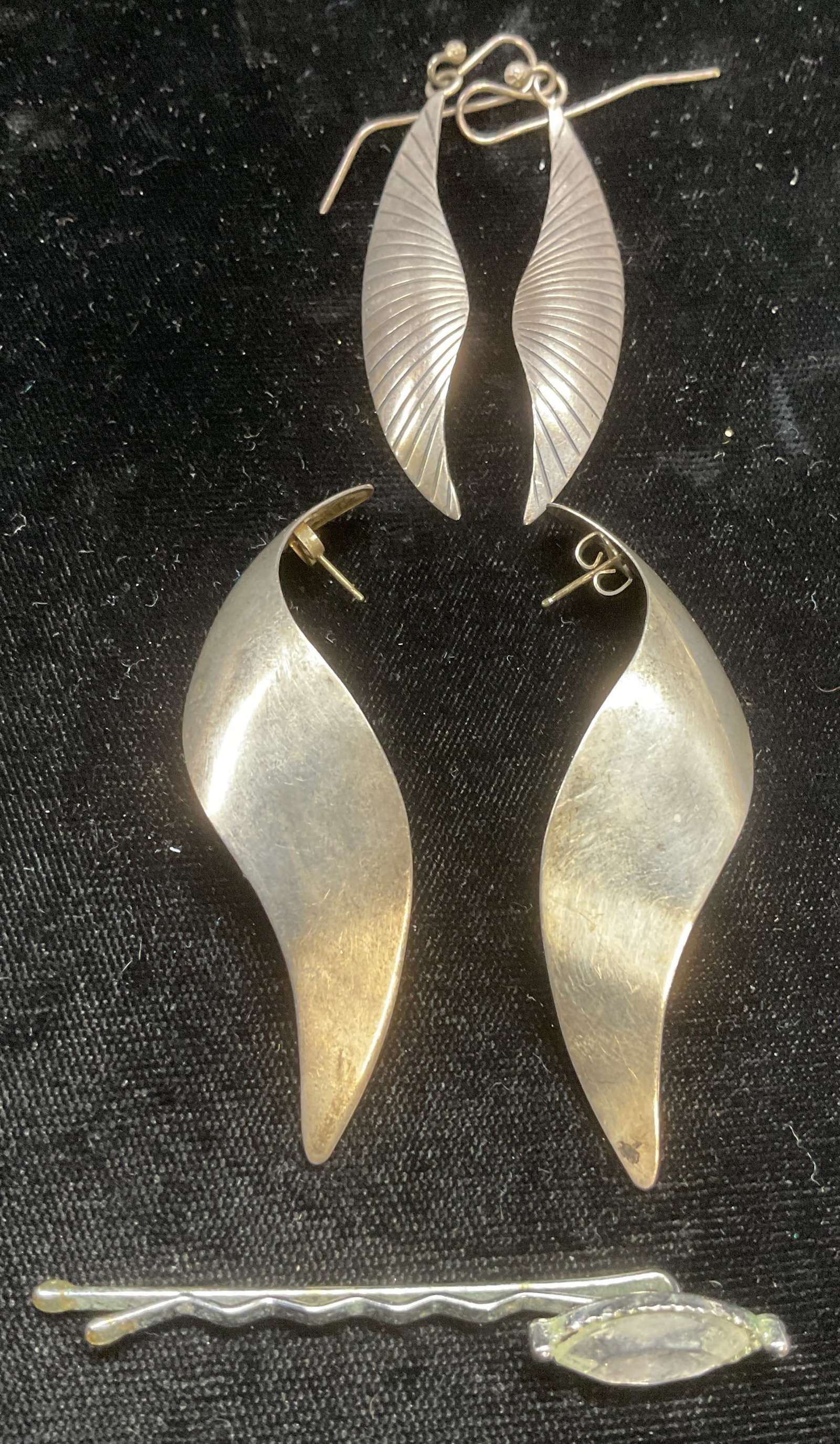 Lot 3 Sterling Silver Earrings, Crystal Bobby Pin: 2 pairs of sterling silver earrings. Twist and ribbed motifs. Test for sterling. Silver tone colorless crystal Bobby pin. Largest piece approx 2.5 inches long. Total weight of silver .36 ozt. Some wea