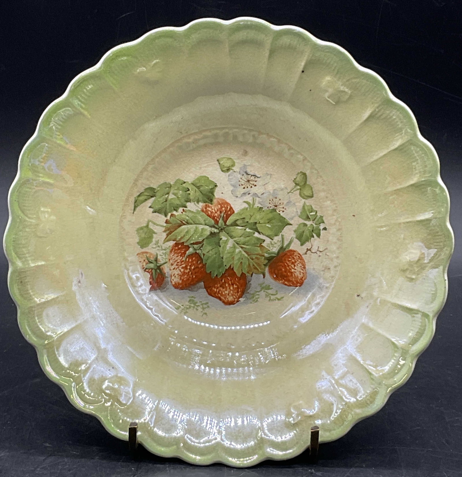 LIMOGES Vntg Iridescent Strawberry Porcelain Bowl: LIMOGES Vintage Iridescent Strawberry Motif Porcelain Bowl. Multicolored hues to the piece. Scalloped rim. Underside signed LIMOGES CHINA. Measures approx. 1.75H x 6.5W in. Pitting, discoloration, cra
