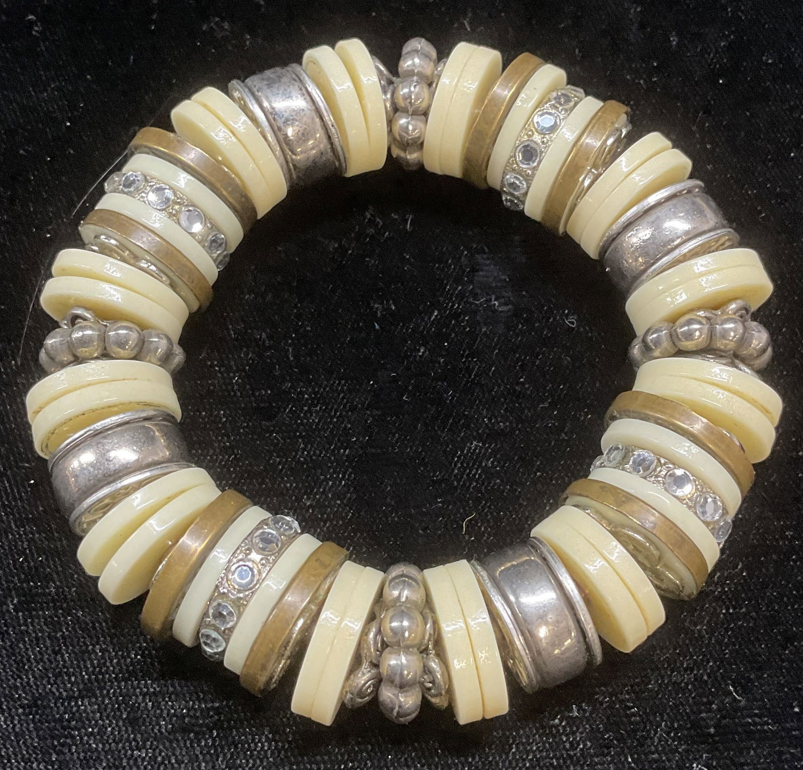 Faux Bone, Silver Tone, Crystal Beaded Bracelet: Vintage beaded stretch bracelet with faux bone, silver tone, and crystal accents. Measures approx 2.5 inches wide. Some wear including scratching observed. Jewelry, estate jewelry, costume jewelry, co