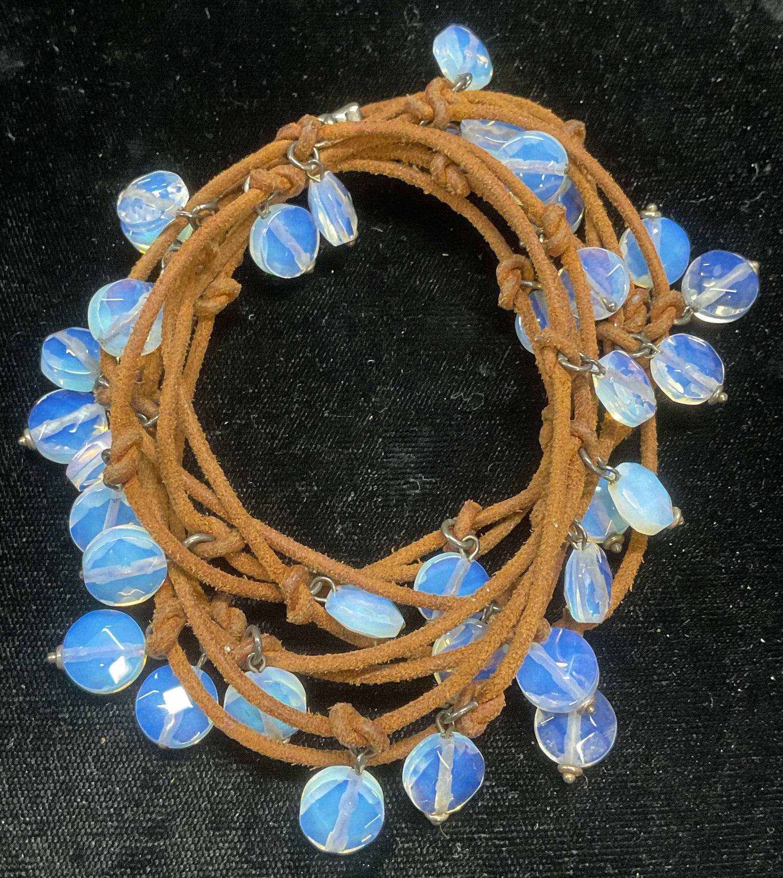 Faux Moonstone Crystal Beaded Necklace: Faux moonstone Crystal beaded necklace on brown leather cord. Drop length approx 34 inches. Some wear including scratching observed. Jewelry, estate jewelry, costume jewelry, cocktail jewelry, fashion