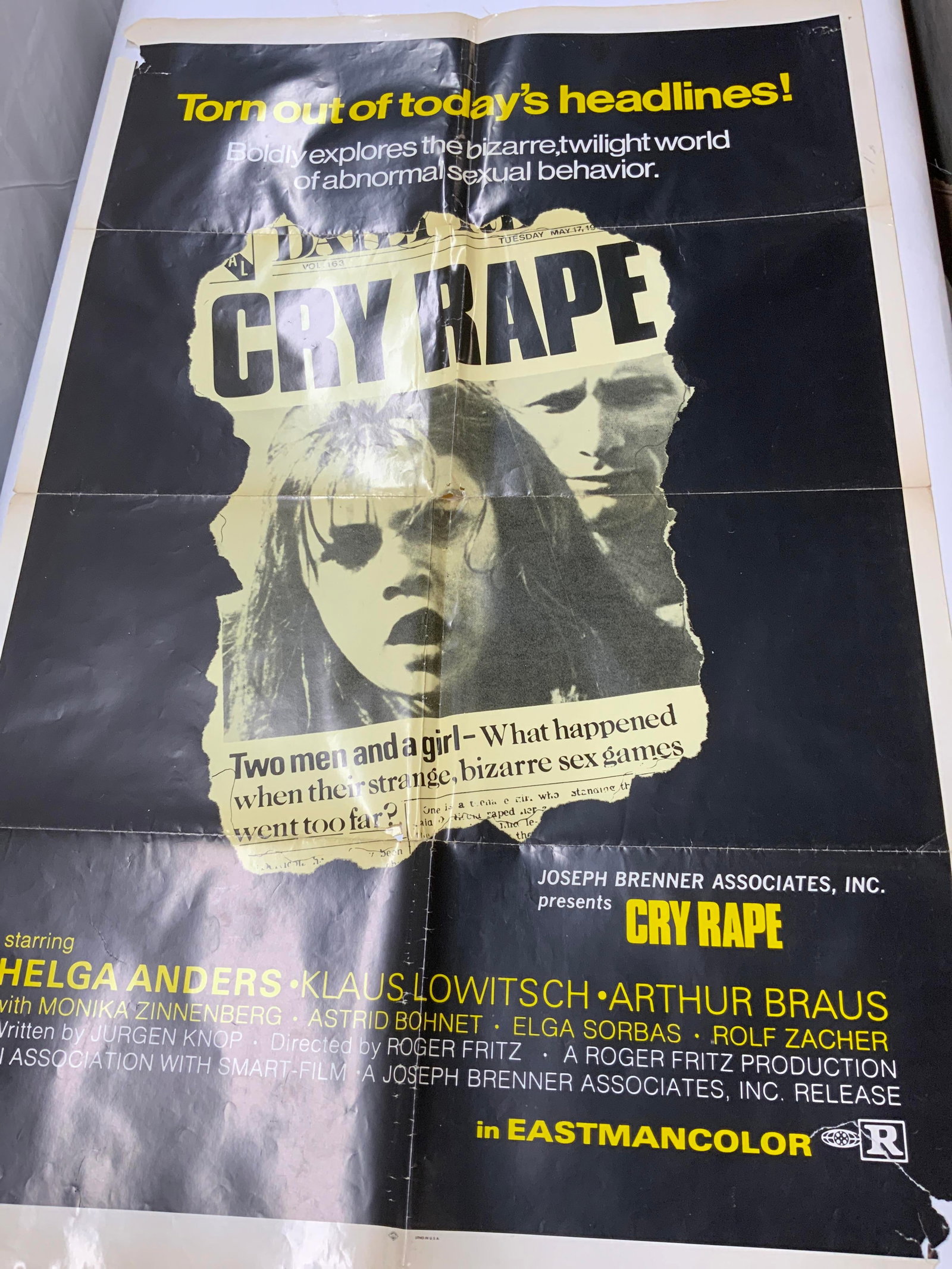 Vintage Cry Rape Movie Poster 1970s: Vintage Cry Rape Movie Poster 1970s Movie poster with an image of a woman on the front and a man in the back. Has bold yellow & black colors. Extensive wear and tear on poster. Has ripping and folding