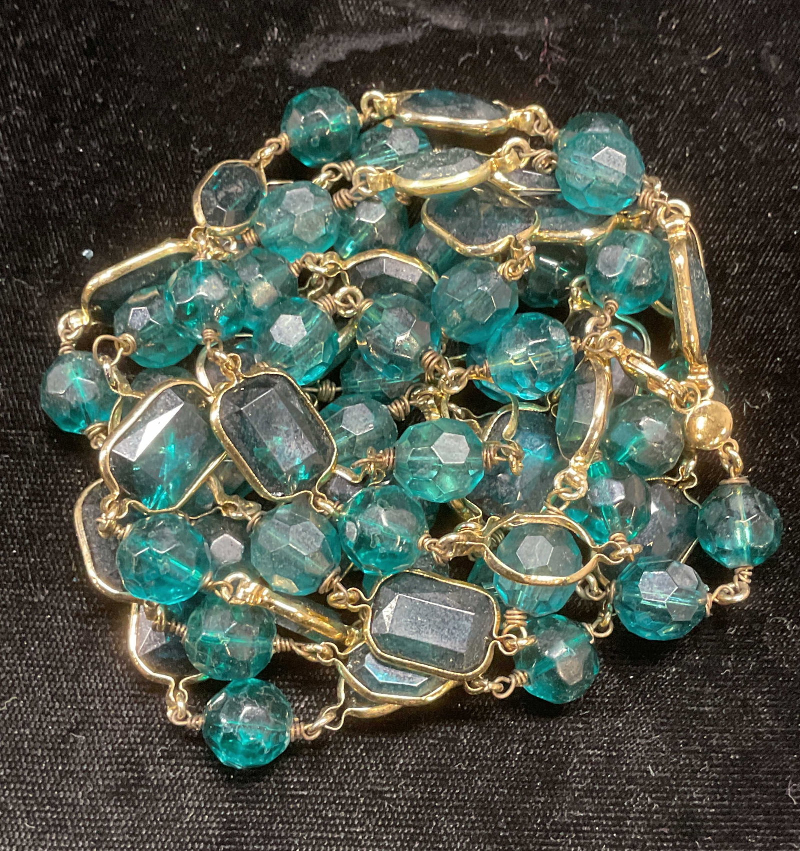 LC Gold Tone Blue Crystal Necklace: Signed LC gold tone and blue crystal necklace. Drop length approx 29.5 inches. Some wear including scratching observed. Some crystal need replacement. Jewelry, estate jewelry, costume jewelry, cocktai