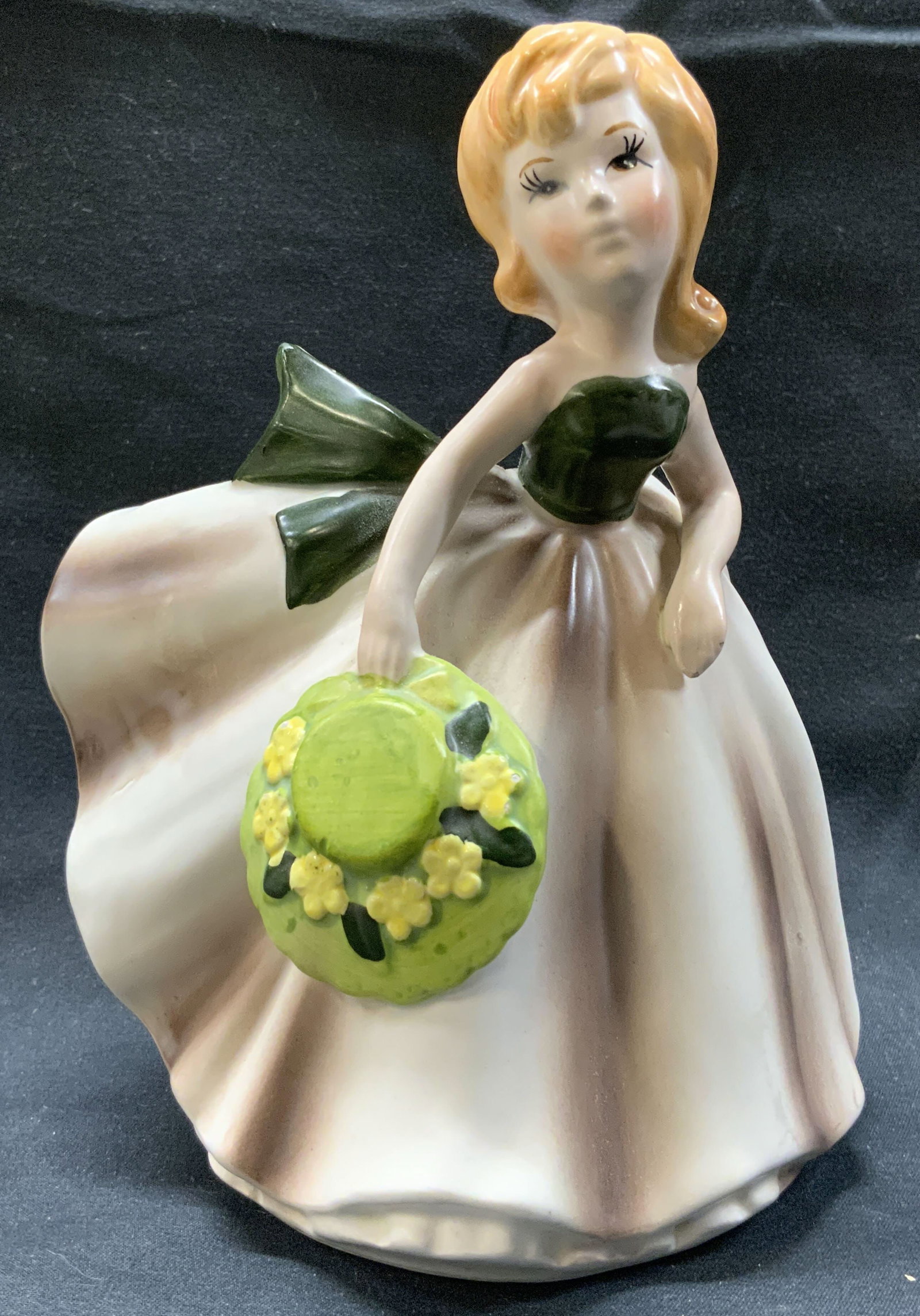 Vintage Relpo 5878 Porcelain Woman Planter: Vintage Relpo 5878 Porcelain Woman Planter Porcelain planter, it is shaped in a woman holding a green hat. Shes wearing a green top and a white with purple skirt. The back has an opening. Underside re