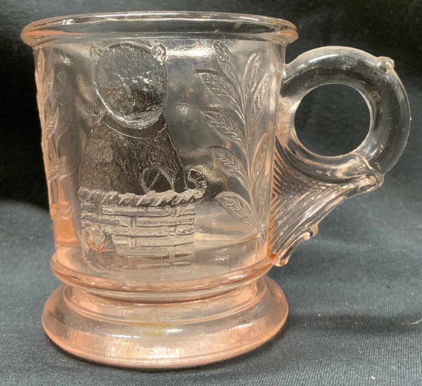 Pink Depression Puppy & Kitten Motif Baby Glass: Pink Depression Puppy & Kitten Feature Baby Glass Pink depression baby glass with features of a puppy in a drum on one side & a kitten sitting on a nest on the other. Surface wear consistent to age, u