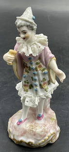 Vintage Meissen Porcelain Harlequin Clown Figural: Vintage porcelain clown, possibly a Meissen Harlequin figurine. The piece is Hand painted and features porcelain lace work. Underside is trademarked, possibly Meissen. Measures approx. 4.5H x 1.75W in