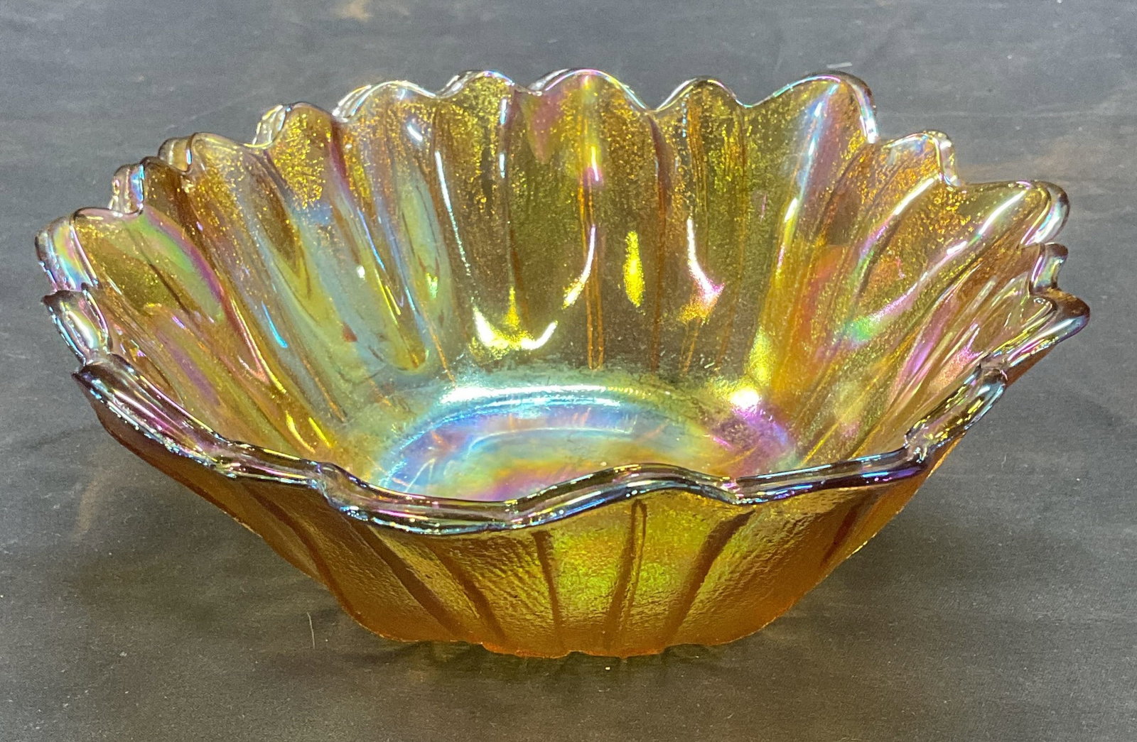 Vtg Amber Carnival Glass Sunflower Bowl: Vintage amber carnival glass pressed sunflower motif bowl. Measure approx 7 x 2.5 inches. Some wear including scratching. Sunflower bowl, flower bowl, amber glass, amber glass bowl, carnival glass, ca
