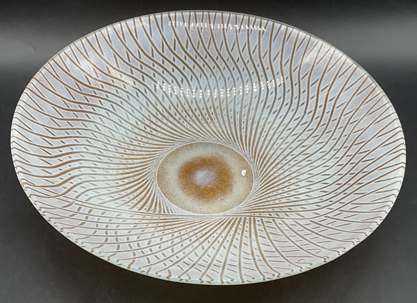 H.W. Swirled Art Glass Serving Bowl / Fruit Bowl: H.W. Swirled Art Glass Serving Bowl / Fruit Bowl. Primarily orange and white hues. Measures approx. 2.75H x 11.75W in. Appears to be signed H.W. Surface wear consistent with age, use, and exposure. Re