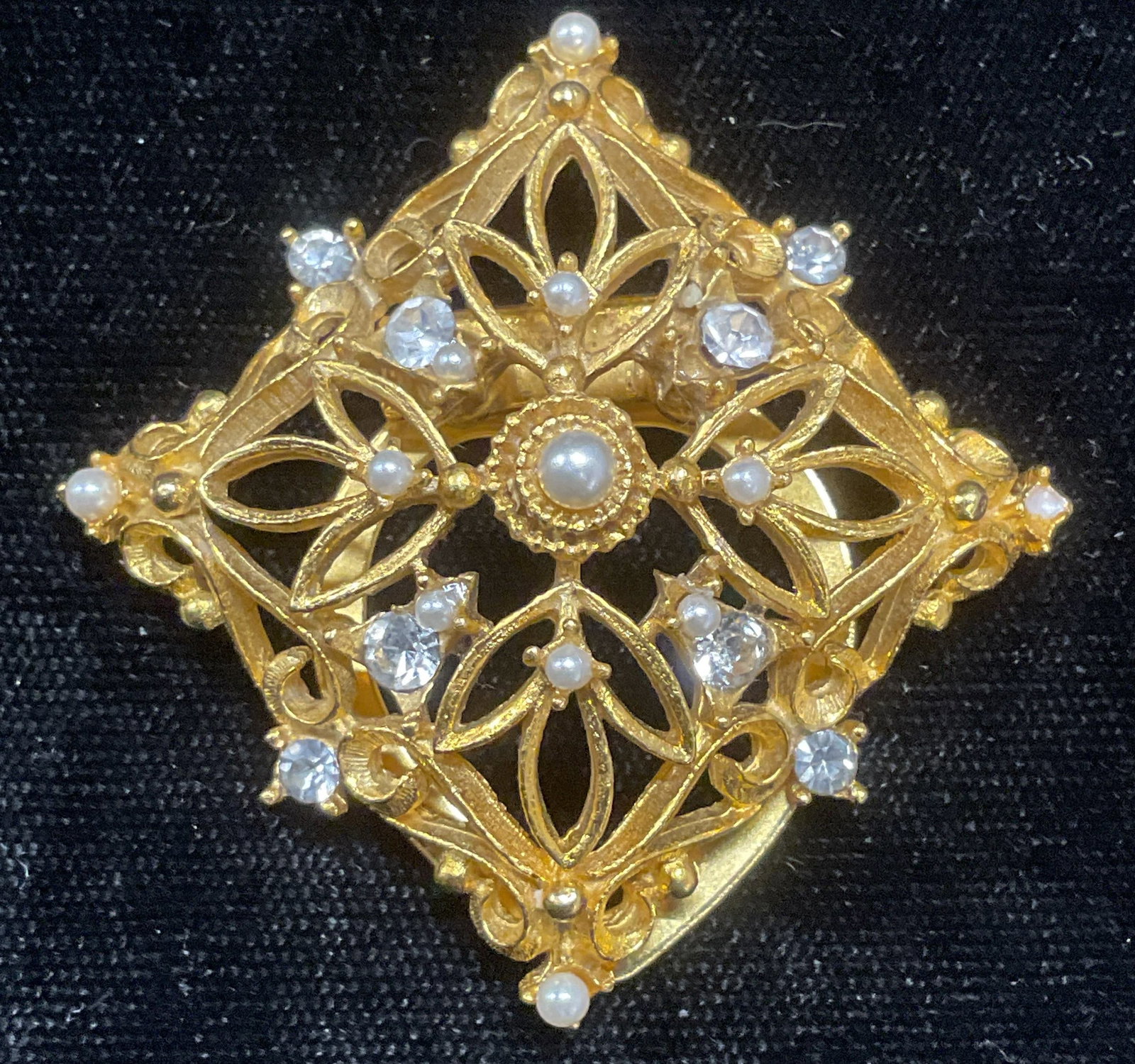 Vintage JJ Gold Tn Faux Pearl Scarf Clip: Vintage JJ gold tone reticulated scroll scarf clip with faux pearl and crystal. Signed on underside. Measures approx 2 x 2 inches. Some wear including scratching observed. Jewelry, estate jewelry, cos
