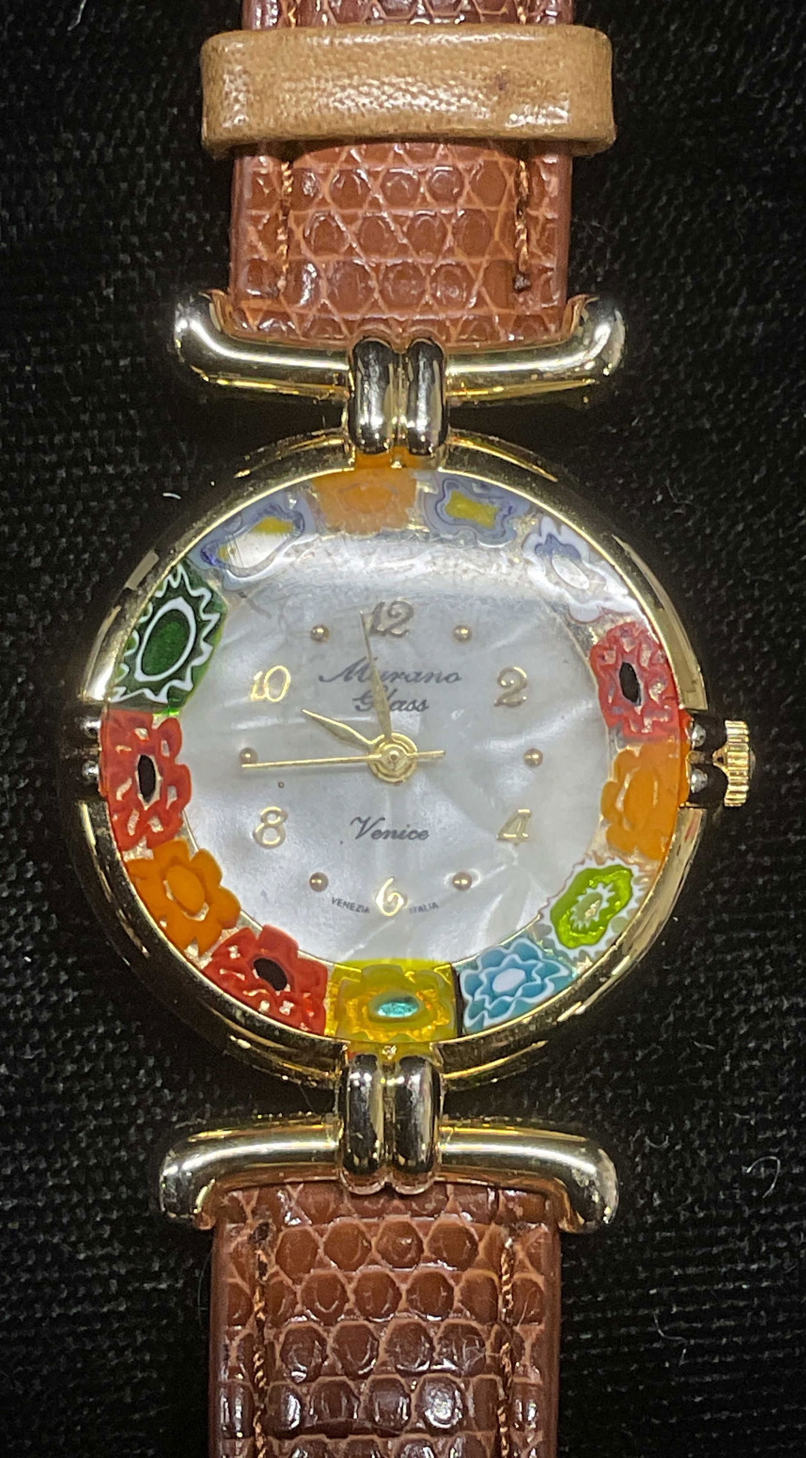 Murano Venice Art Glass Mosaic Watch Italy: Murano Venice Art glass watch with mosaic millefiori dial. Signed on dial. Made in Italy. Brown leather strap. Measures approx 7.75 inches long. Not tested for function. Some wear including scratching