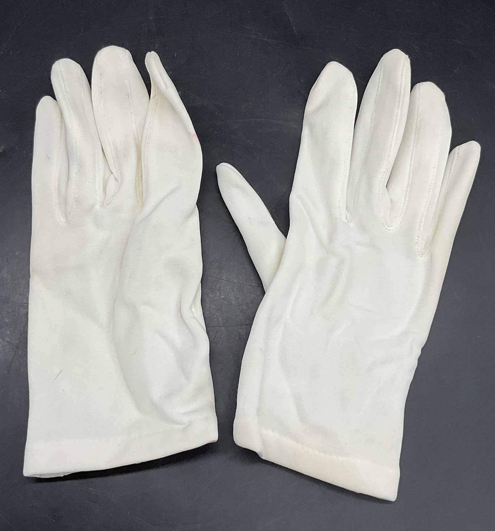 Vintage White Gloves, Malta: Vintage White Gloves. Tag to interior reads Made in Malta, 58% NYLON, 42% RAYON. Tag is worn. Measures approx. 8L x 3.25W in. Discoloration and surface wear present. Wearables, fashion, fashionware, F