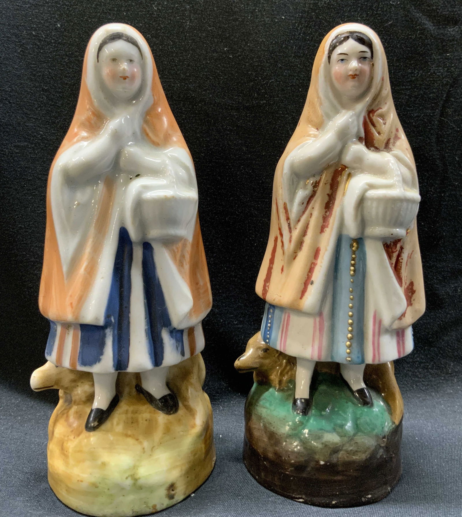 Lot 2 Antique Little Red Riding Hood Figural: Lot 2 Antique Little Red Riding Hood Figural 2 porcelain figural, they both have different colors & features. They are each holding a white basket, wearing a red hooded cape & dress. Including a wolf