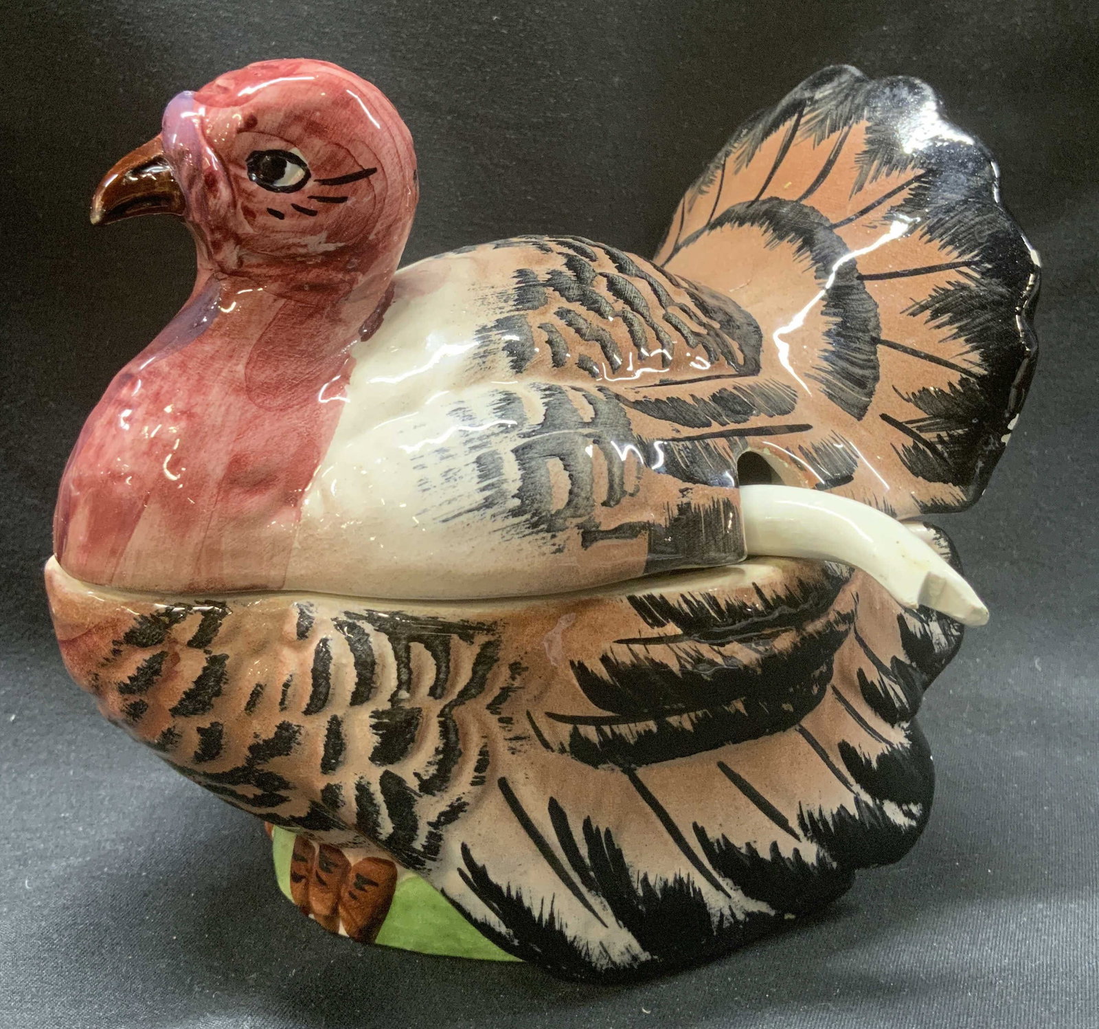 Vintage Ceramic Turkey Gravy Boat w Spoon: Vintage Ceramic Turkey Gravy Boat w Spoon. Ceramic gravy boat in shape of a Turkey. The turkey has maroon, brown & black colors. Has an opening in the middle for a spoon. Very distinctive details on c