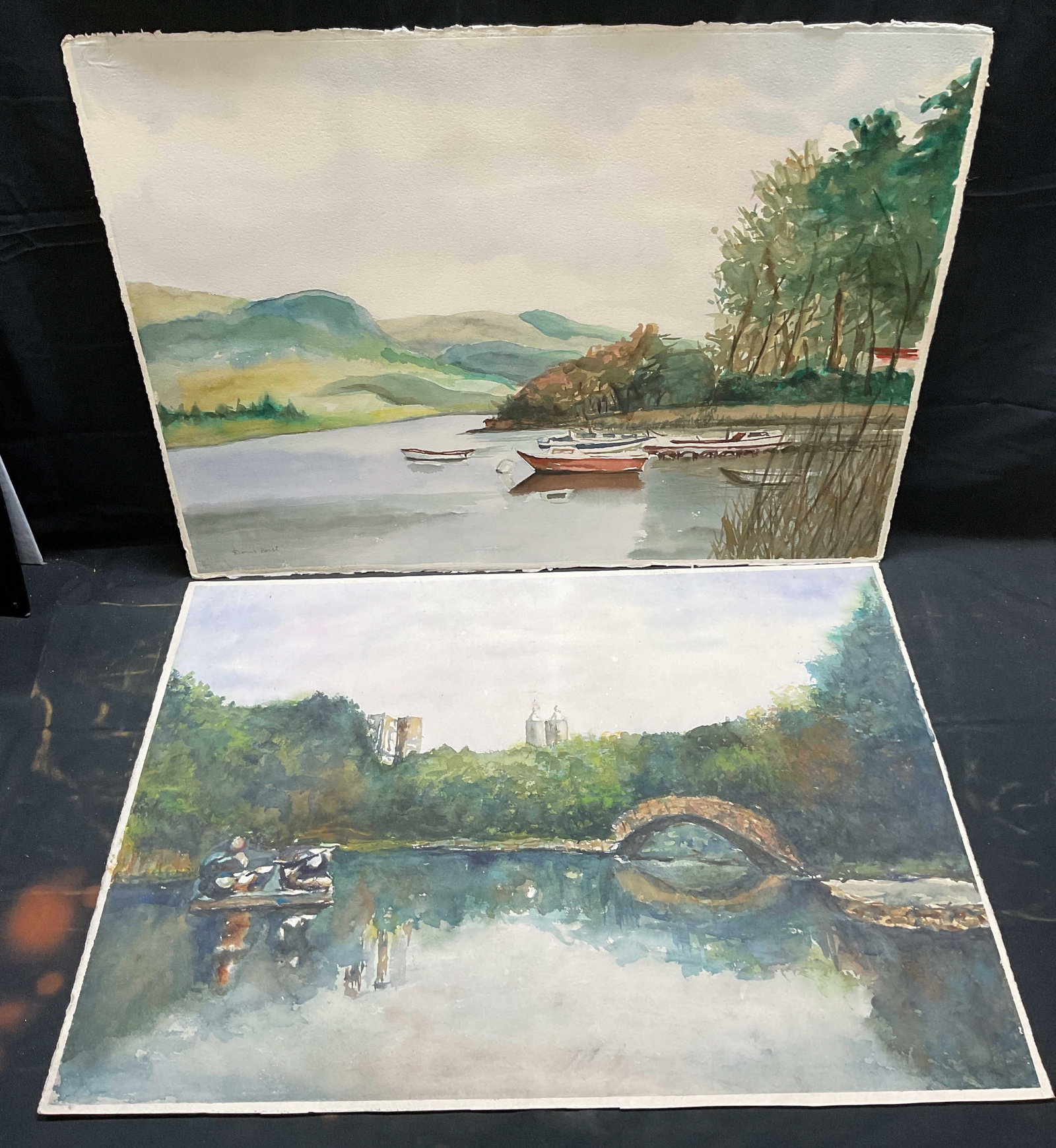 Lot 2 Doris Borst Boat Scene Watercolor Painting: Lot of 2 watercolor on paper paintings. 1 painting signed Doris Horst, landscape scene with lake, boats, and dock. 1 painting unsigned, park scene with figures on raft and city skyline. Paper measures