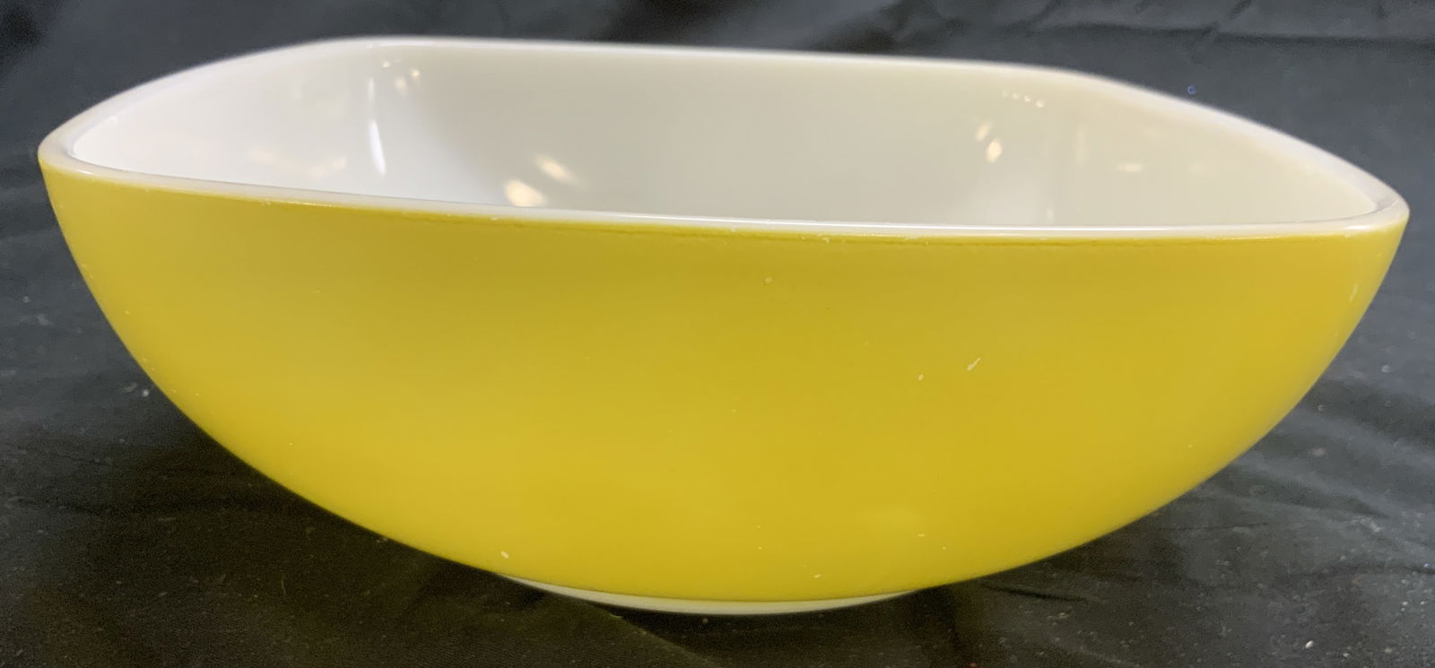 PYREX Vntg Serving Bowl Yellow & White: Underside is trademarked PYREX. Bowl is yellow with white toned exterior. Bowl has rounded square form. Piece measures approximately 7.75 inches wide & deep 2.75 inches tall. Bowl, serving bowl, Pyrex
