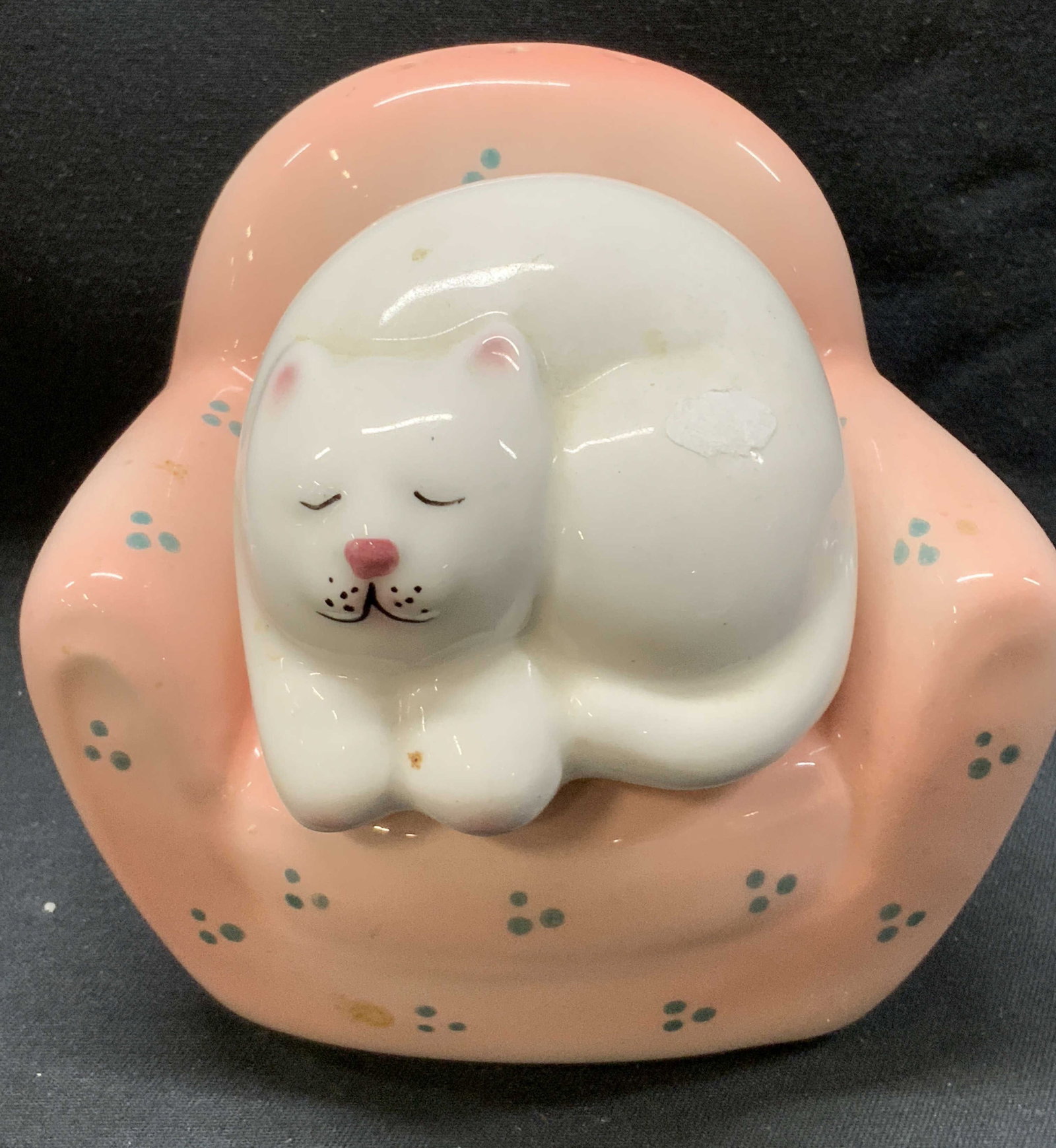CLAYART Kitten & Chair Salt&Pepper Shakers PHL: CLAYART Kitten & Pink Chair Salt & Pepper Shakers. 2 ceramic salt & pepper shakers, including a white sleeping kitten laying on a pink chair. Pink chair has green polka dots. They have a glossy color.