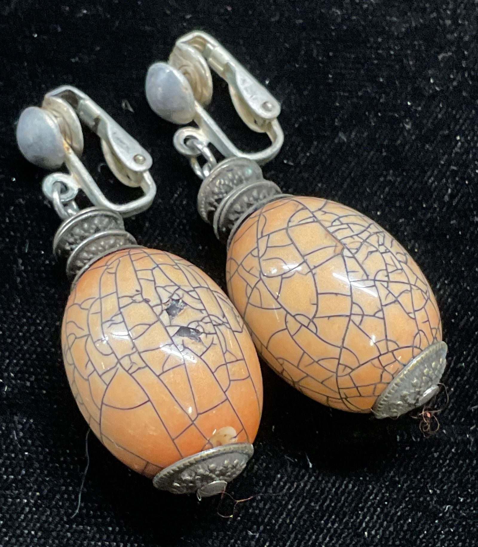 Vintage Orange Faux Crack Beaded Earrings: Vintage silver tone earrings with orange composite beads, faux crackle design. Measure approx 2 inches long. Some wear including scratching and chipping observed. Jewelry, estate jewelry, costume jewe