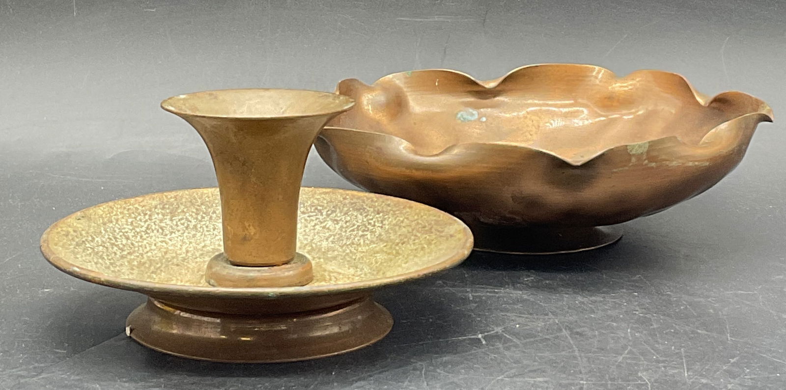 2 Vintage Copper Tableware, Signed Floral Bowl +: Two pieces of vintage copper tableware. One signed copper candlestick and one floral bowl. Underside of the bowl is signed, illegible. The underside of the candlestick appears to read Nekrassoff. The