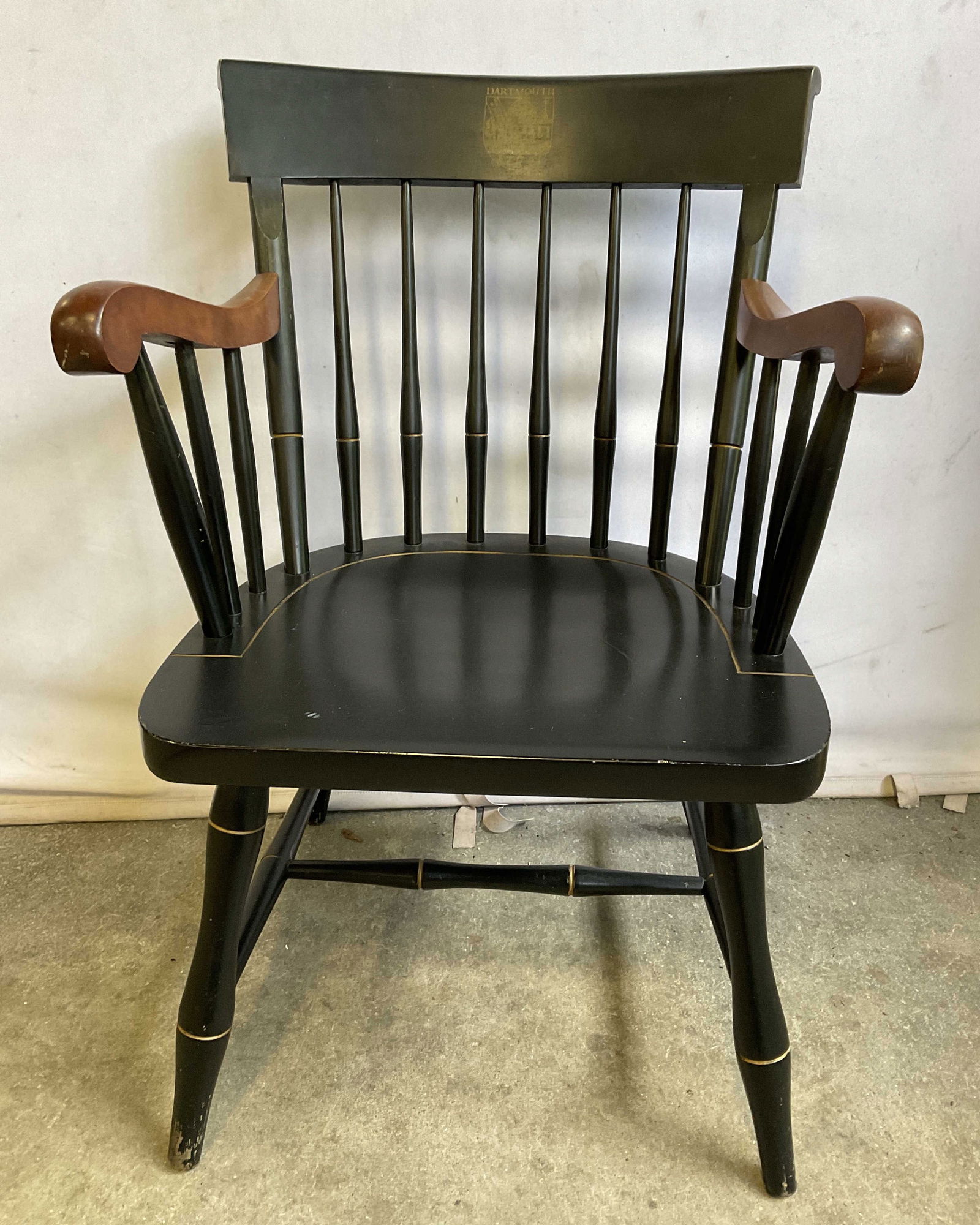 NICHOLS & STONE Dartmouth College Chair USA: NICHOLS & STONE Dartmouth College Chair with Armrests. Crafted from wood. Black and brown hues throughout. Tag to underside reads NICHOLS & STONE. Gardner, Massachusetts. Measures approx. 34H x 20W x