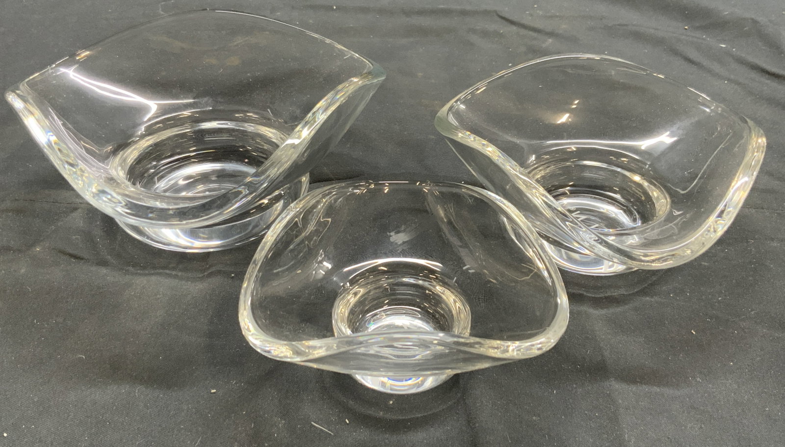SIN Set 3 Art Glass Bowls: Each bowl is trademarked SIN. Lot includes 3 bowls, each are glass. Bowls each have handkerchief style rims. Largest bowl measures approximately 5.5 inches wide 2.25 inches tall. Bowls, glass bowls, a