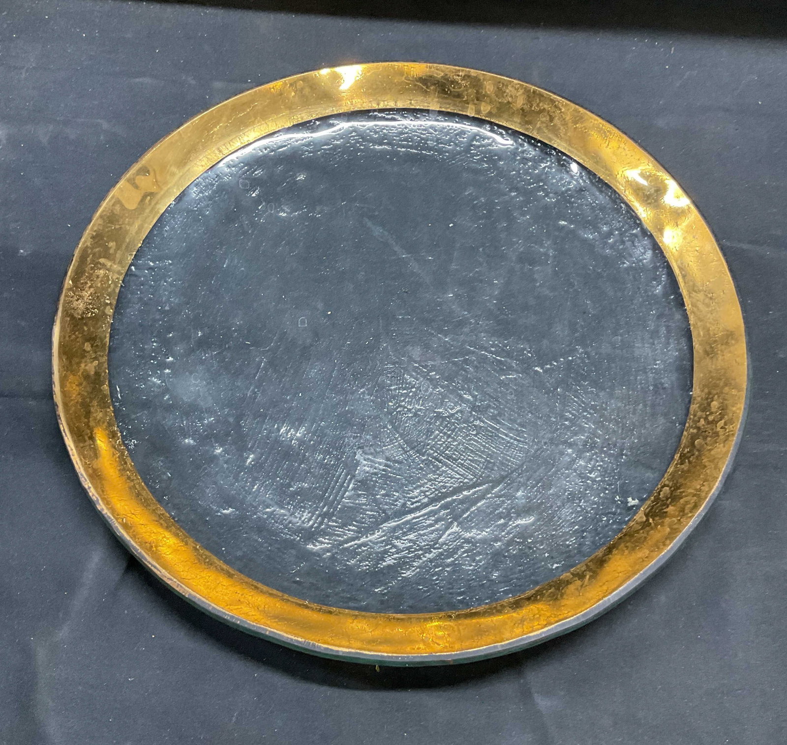 Gilt Textured Glass Round Platter: Textured glass platter with gilt rim. Round shaped. Measures approx 12 inches wide. Some wear including loss to gilt and scratching. Platter, glass platter, gilt platter, round platter, tableware, tab