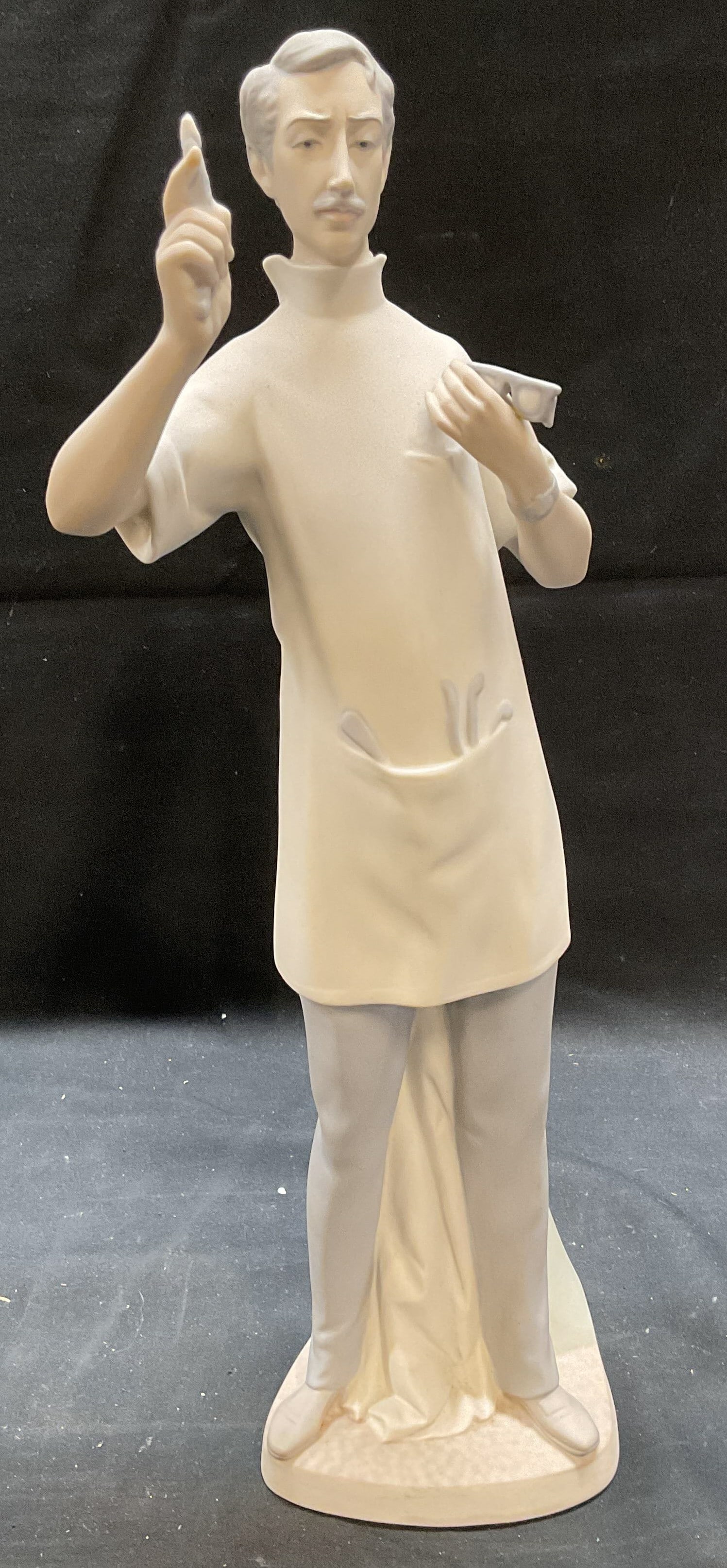 Vtg Lladro Dentist Porcelain Figurine, Spain: Vintage Lladro porcelain figurine. Dentist. Signed on underside. Made in Spain. Matt glaze, hand painted. Measures approx 4.5 x 3.25 x 13.75 inches. Some wear consistent with exposure. Lladro, vintage