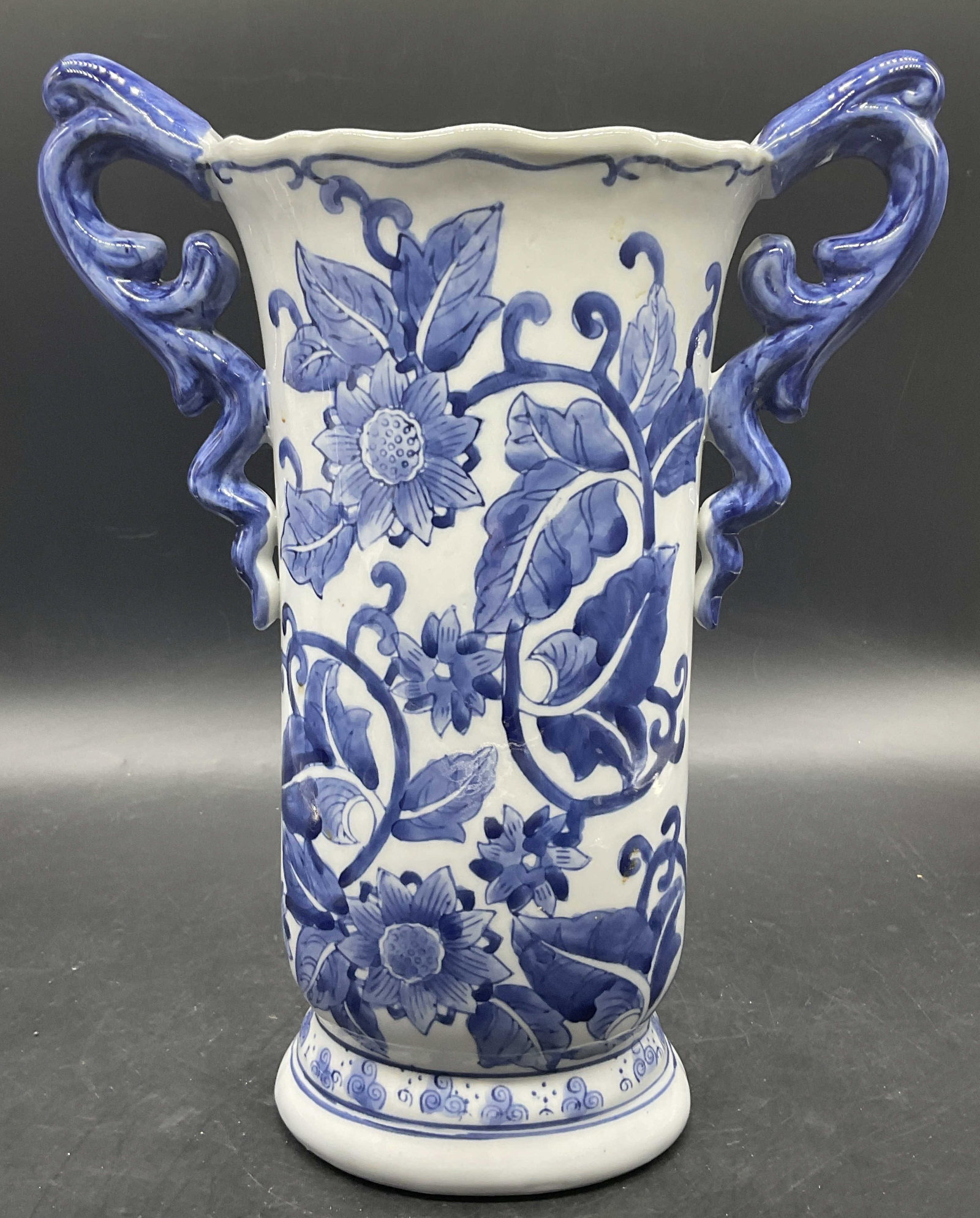 Vintage Blue & White Floral Asian Porcelain Vase: Vintage Blue & White Asian Porcelain Vase. Decorated with florals, foliage, and geometric patterns. Measures approx. 11.5H x 9W in. Pitting, surface wear, and residue present. Underside states the pie