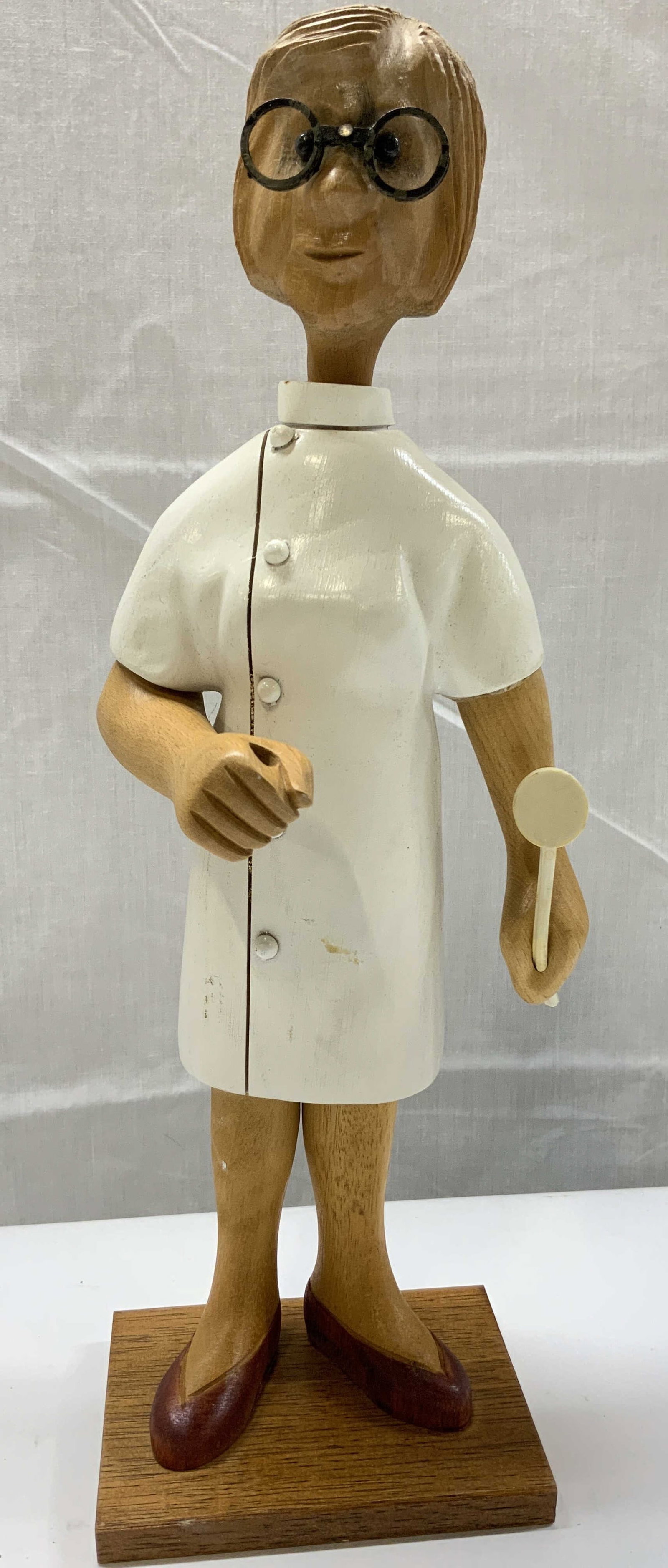 Vintage Romer Female Doctor Wood Figural ITALY: Vintage Romer Female Doctor Wood Figural ITALY Figural made out of wood & in the shape of a female doctor. She is wearing a white coat, glasses & holding a medical instrument. Underside is marked & si
