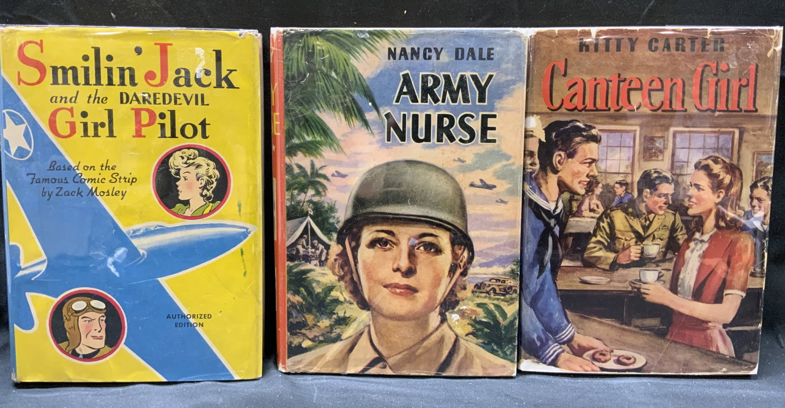 Lot 3 Vintage 1940s WHITMAN Illustrated Books: Lot 3 Vintage 1940s WHITMAN Illustrated Books Lot includes 3 hardcover books. Army Nurse by Nancy Dale, Smilin Jack & the DAREDEVIL Girl Pilot by Zack Mosley, Canteen Girl by Kitty Carter. Each book h