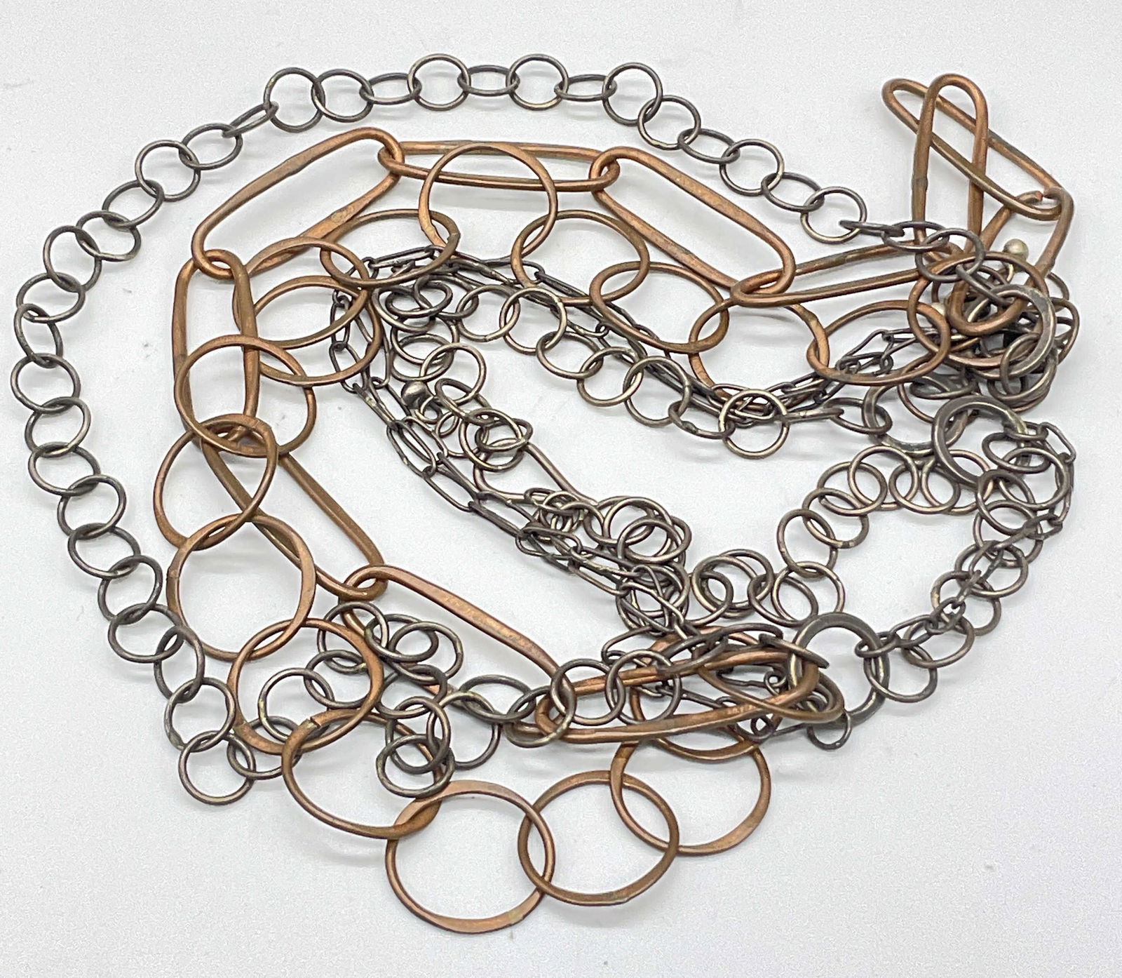 Vintage Multi Chain Necklace: Vintage Multi Chain Necklace. Gunmetal and copper hues. Measured end to end approx. 21.5 inches in length. Fishhook clasp closure. Surface wear consistent with age, use, and exposure. Vintage jewelry,