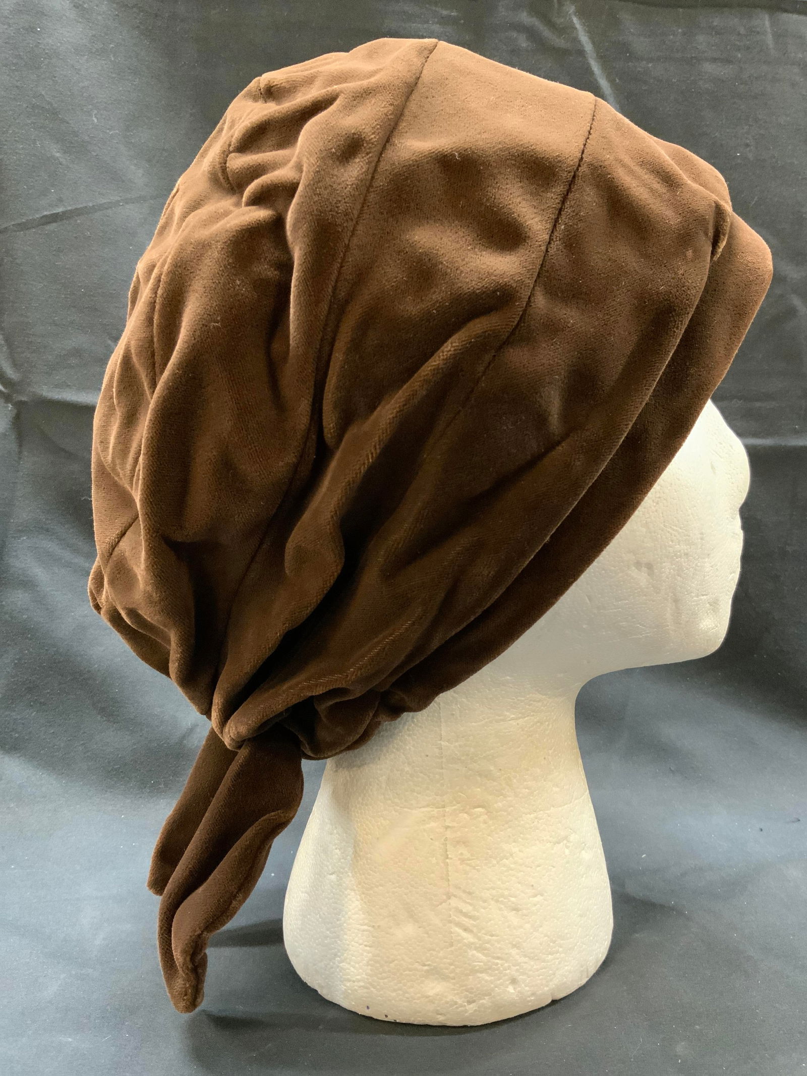 Vintage Brown Velvet Bonnet Style Hat: Vintage Brown Velvet Bonnet Style Hat Brown velvet bonnet with ties in the back. Interior has a navy color, possibly satin material. Measurements: length 9in x width 8in. Bonnet hat, womans hat, women
