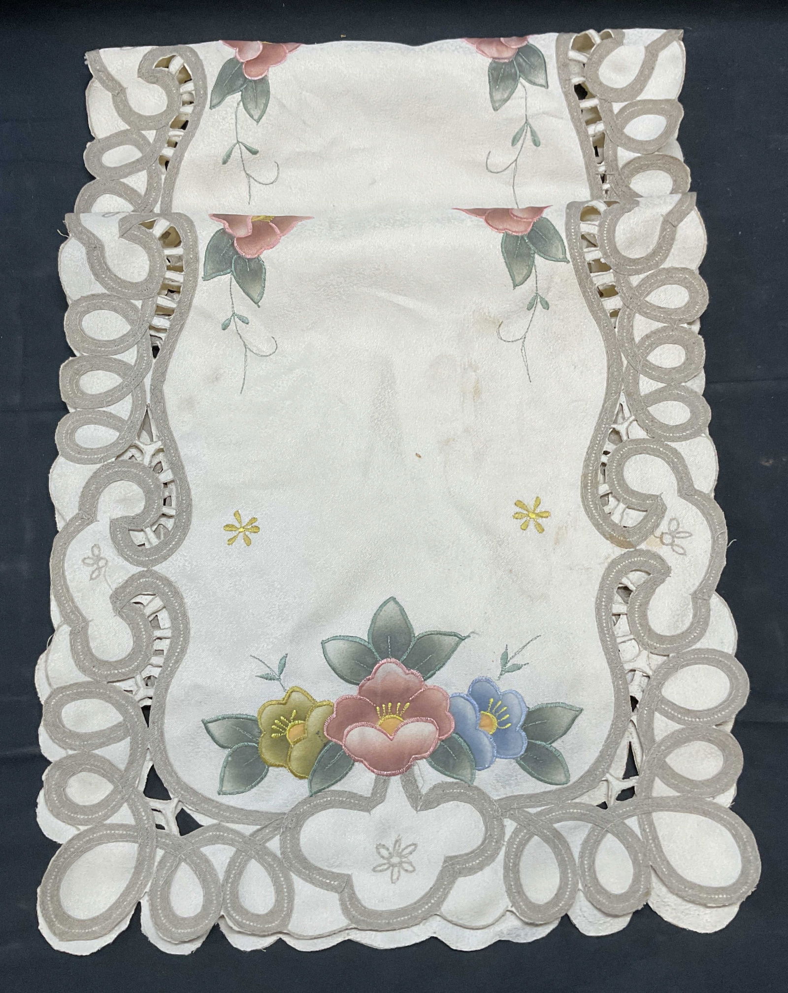Pair Floral Embroidered Table Runners: Pair of floral embroidered table runners in cream. Synthetic material, measure approx 33.5 x 15 inches each. Some wear to each including blemishes observed. Table runners, floral table runner, cream t
