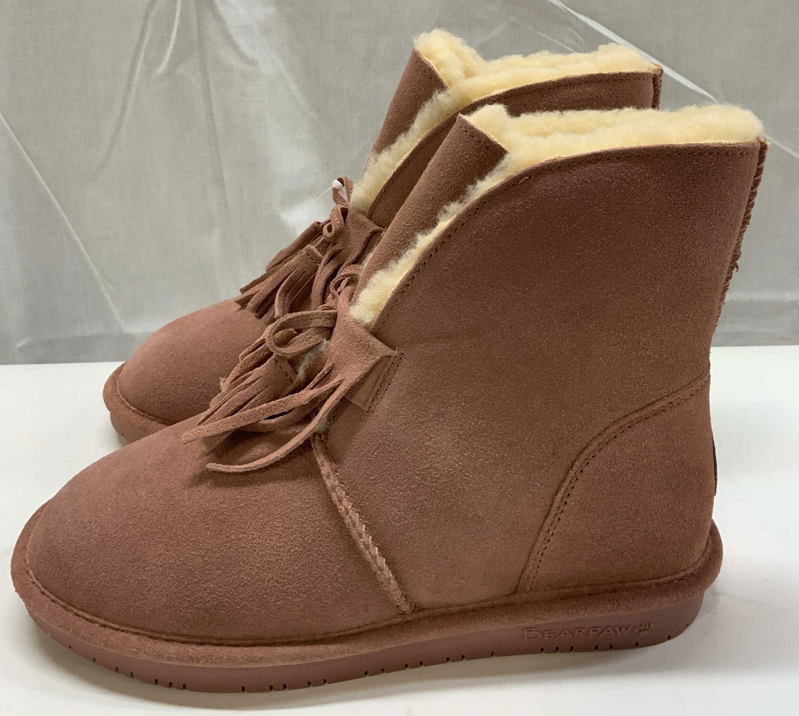 BearPaw Pink Winter Boots NIB: BearPaw Pink Winter Boots NIB Size 7 pink winter boots, they come NIB with tags. Boots have NeverWet tags, stating that boots have a superhydrophobic treatment to repel stains. Visible markings & sign