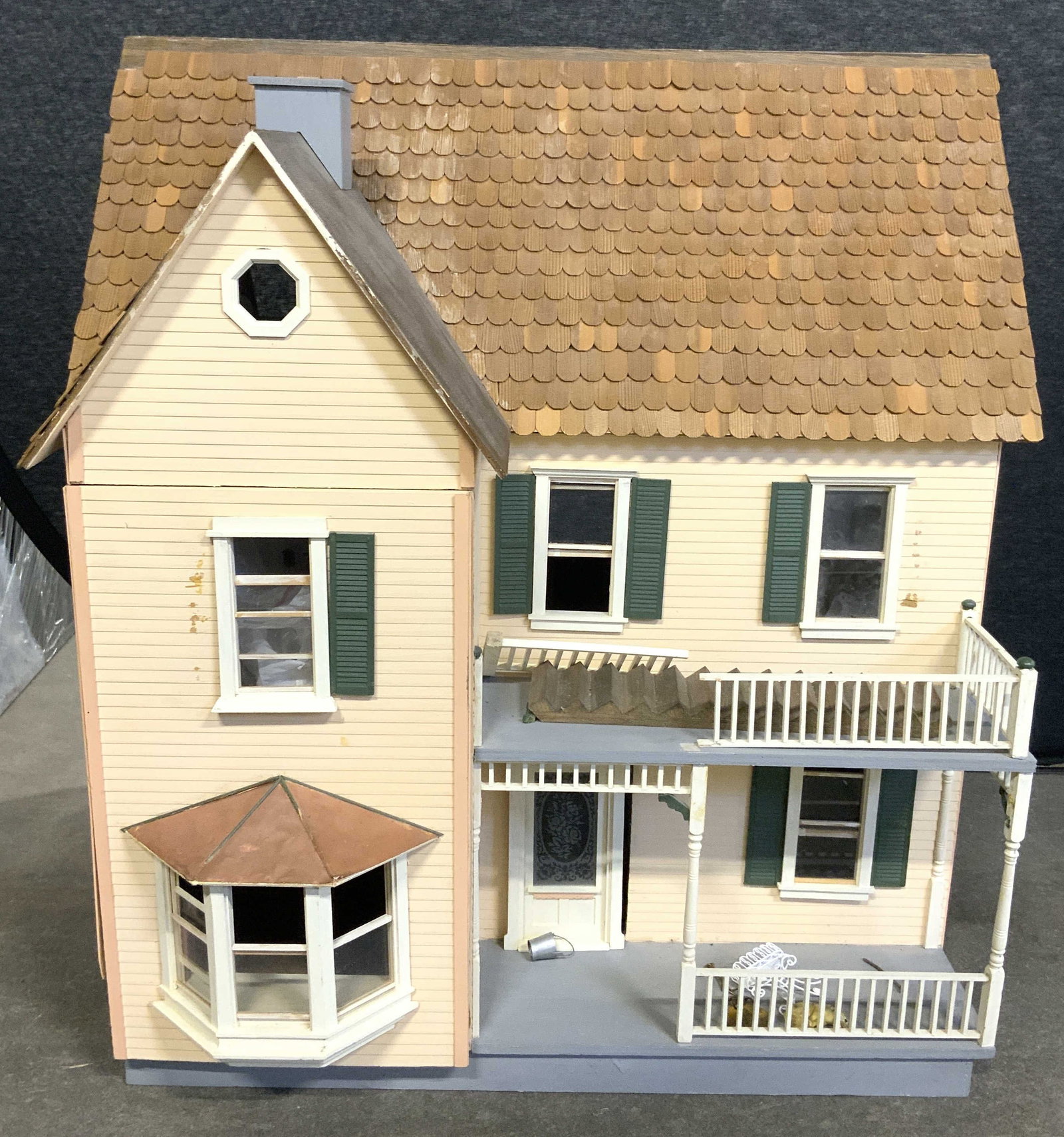 Vintage Doll House W Accessories 32inH: Doll house is vintage. Piece has 2 floors & attic area. Doll house includes various accessories & doll house furniture. Doll house measures approximately 32 inches tall 30 inches wide 25 inches deep. 