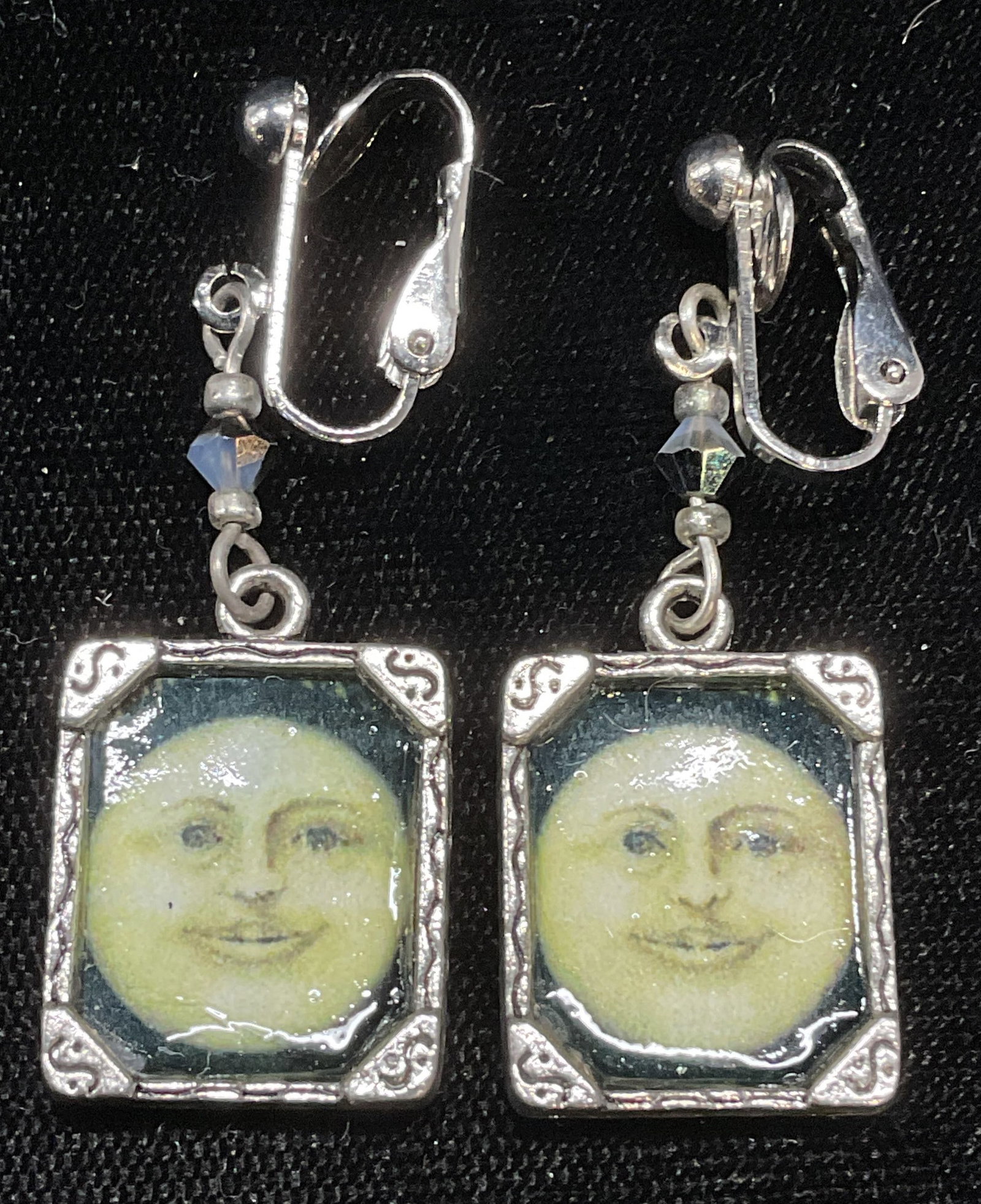 Silver Tone Moon Face Pendant Earrings: Silver tone pendant earrings with moon face motif. Measure approx 1.75 inches long. Some wear including scratching observed. Jewelry, estate jewelry, costume jewelry, cocktail jewelry, fashion jewelry