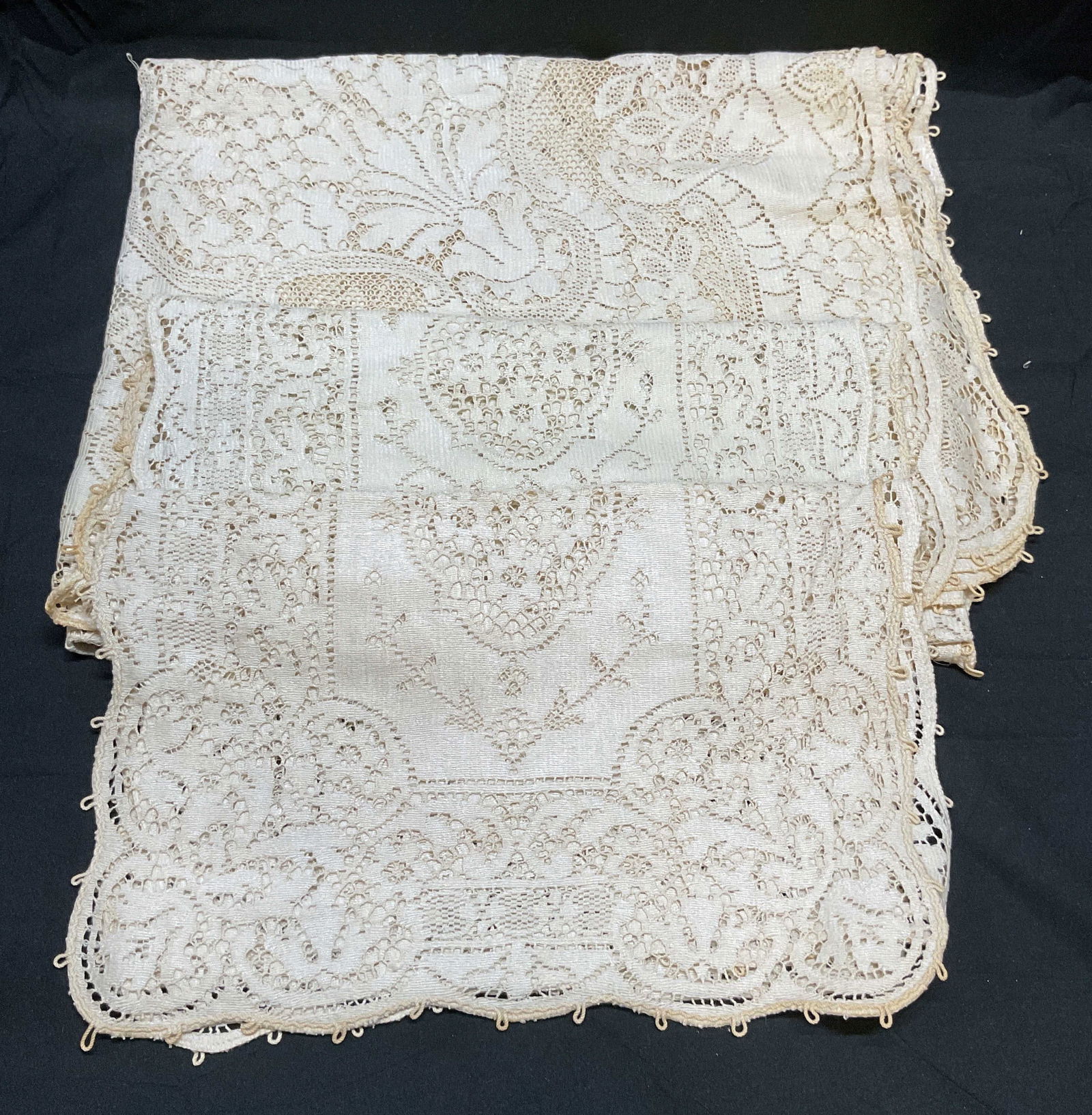 Lot 3 Vintage Quaker Lace Tablecloth & Runners: Lot of 3 Vintage white lace table linens. Lace tablecloth, label reads Quaker. 2 lace table runners. Largest piece measures approx 52 x 64 inches. All pieces have wear including blemishes, pulls, tear