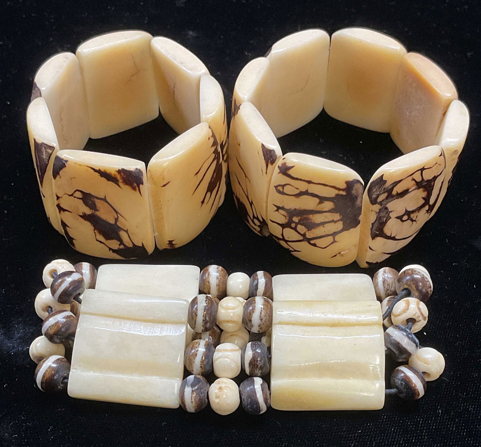 Lot 3 Vintage Tagua Nut Beaded Bracelets: Lot of 3 vintage beaded stretch bracelets. Appear to be carved Tagua nut. Sizes vary. Largest approx 2.5 inches wide. Some wear to all pieces including scratching observed. Jewelry, estate jewelry, co