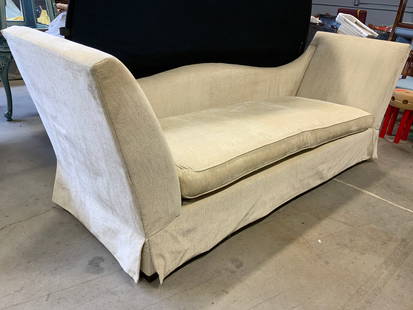 DONGHIA Skirted Upholstery Day Bed Sofa: Tag underneath cushion reads DONGHIA. Day bed is upholstered in cream toned fabric. Sofa is skirted. Piece has 1 large seat cushion. Measures approximately 98 inches long 35 inches tall 30 inches deep