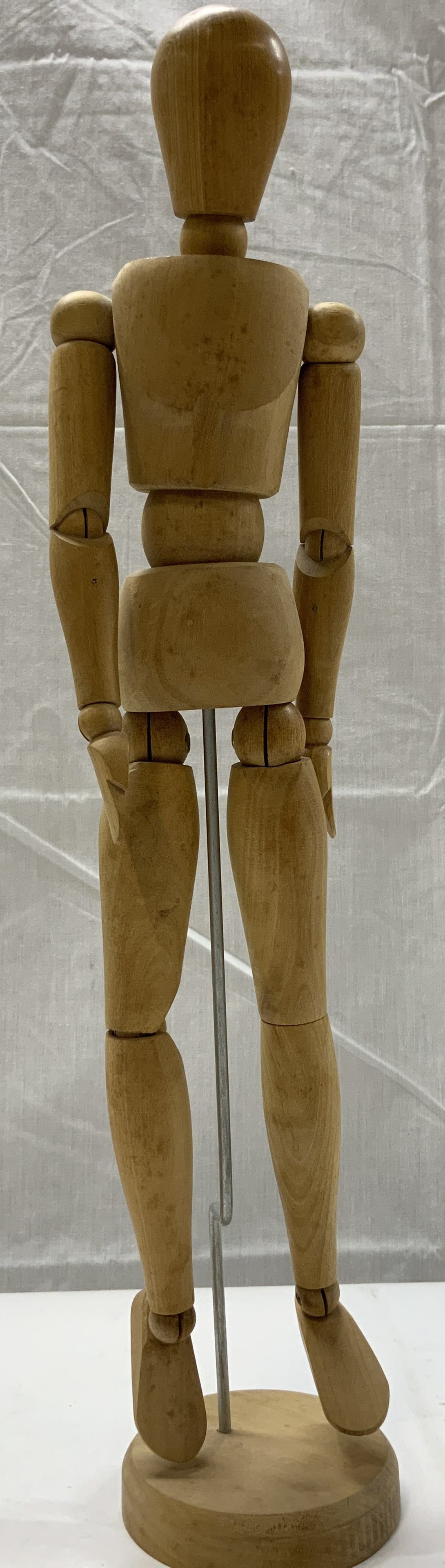 Wooden Artists Mannequin Figural: Wooden Artists Mannequin Figural Wooden figural in the shape of a mannequin, the mannequin is standing upright with a metal rod. It has articulated joints, so the mannequins body moves in different di