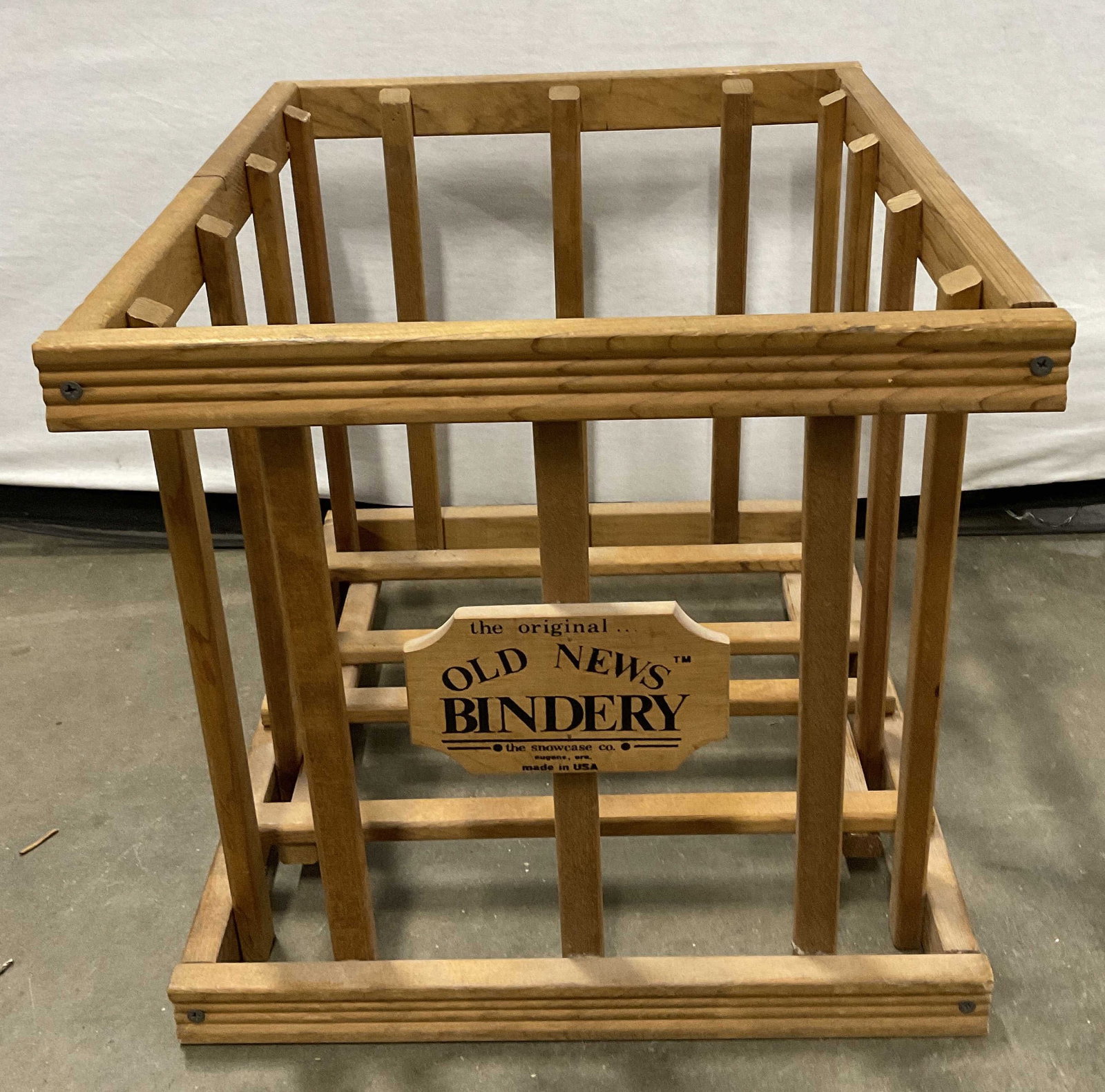 OLD NEWS BINDERY USA Wooden Newspaper Bin Crate: OLD NEWS BINDERY USA Wooden Newspaper Bin Crate. Obverse reads OLD NEWS BINDERY, MADE IN USA. Comes with a removable piece. Measures approx. 18D x 15.5W x 15H in. Separation, surface wear, and chippin