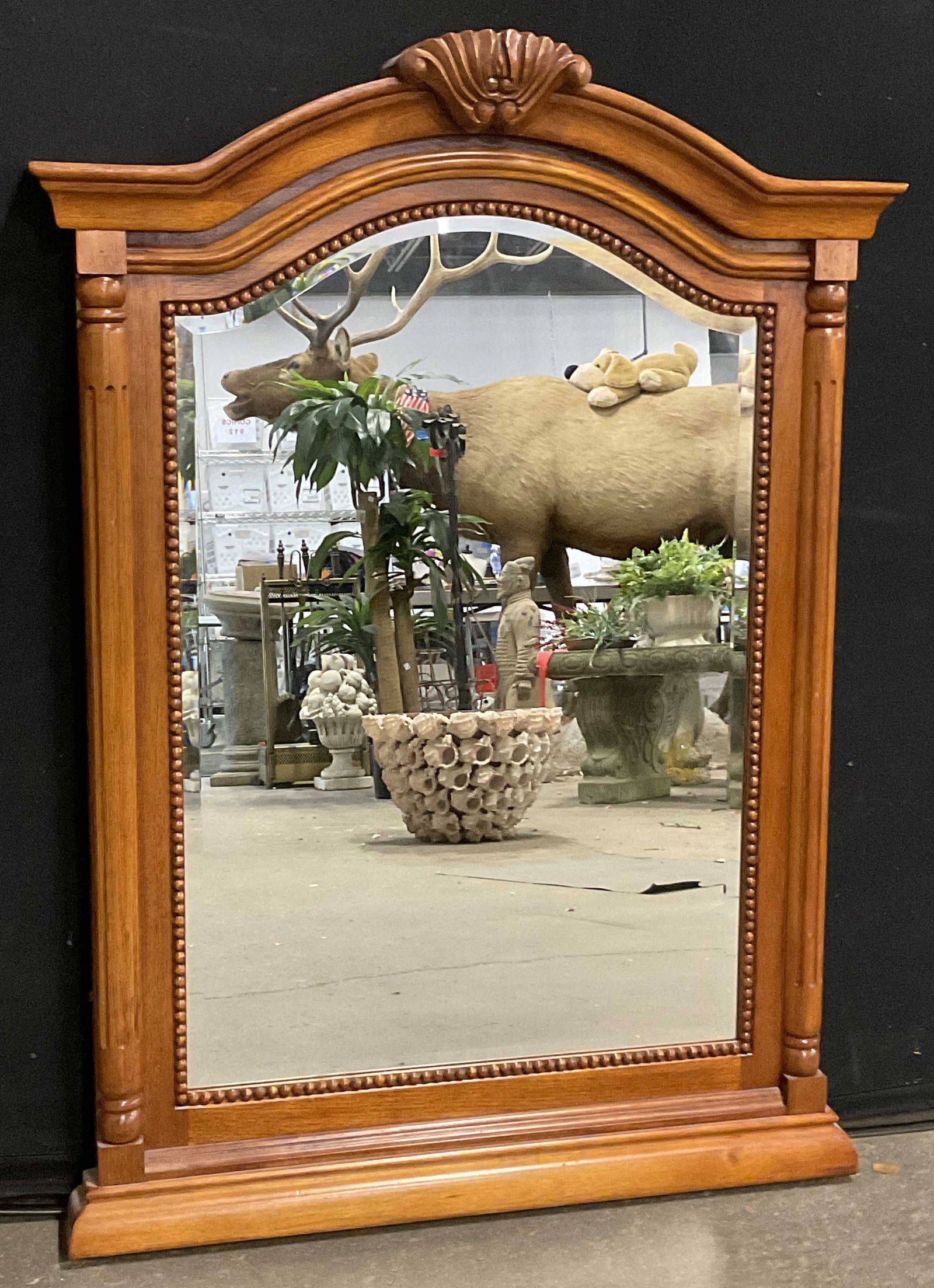Traditional Style Wooden Wall Mirror: Traditional Style Wooden Wall Mirror. Raised woodwork designs to the piece. Metal hardware to reverse. Stickers to the reverse. Measures approx. 36L x 26W in. Surface wear and chipping present. Proper