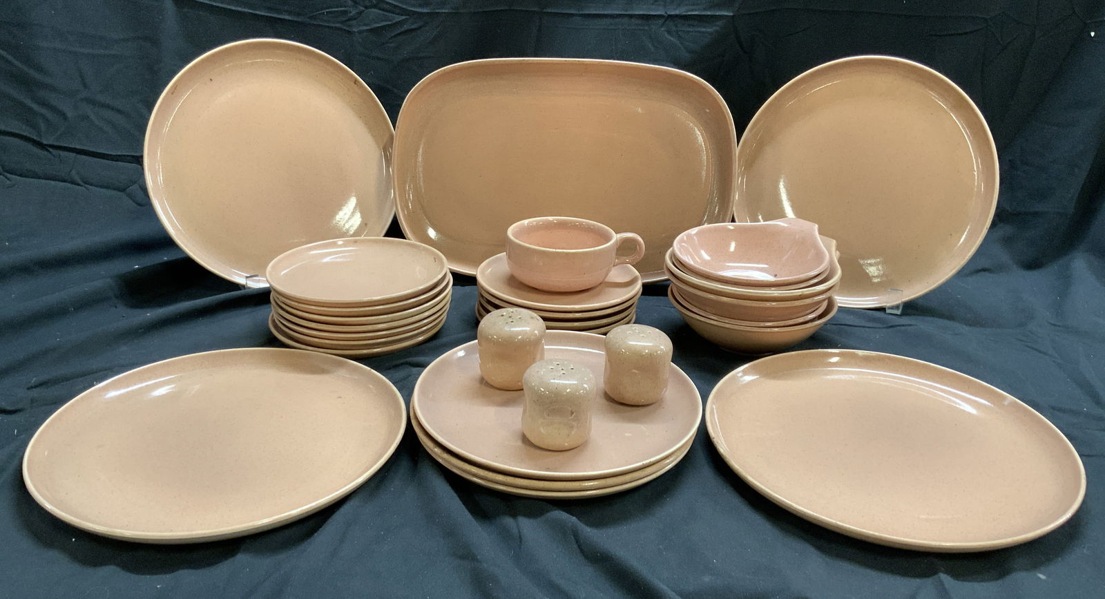 RUSSEL WRIGHT BY STEUBENVILLE 29 Ceramic Dish Set: Undersides are inscribed RUSSEL WRIGHT BY STEUBENVILLE. Lot includes 6 dessert bowls, 4 dinner plates, 3 salad plates, 7 bread plates, 5 saucer, 3 shakers, 1 serving tray, & 1 teacup. Serving dish mea