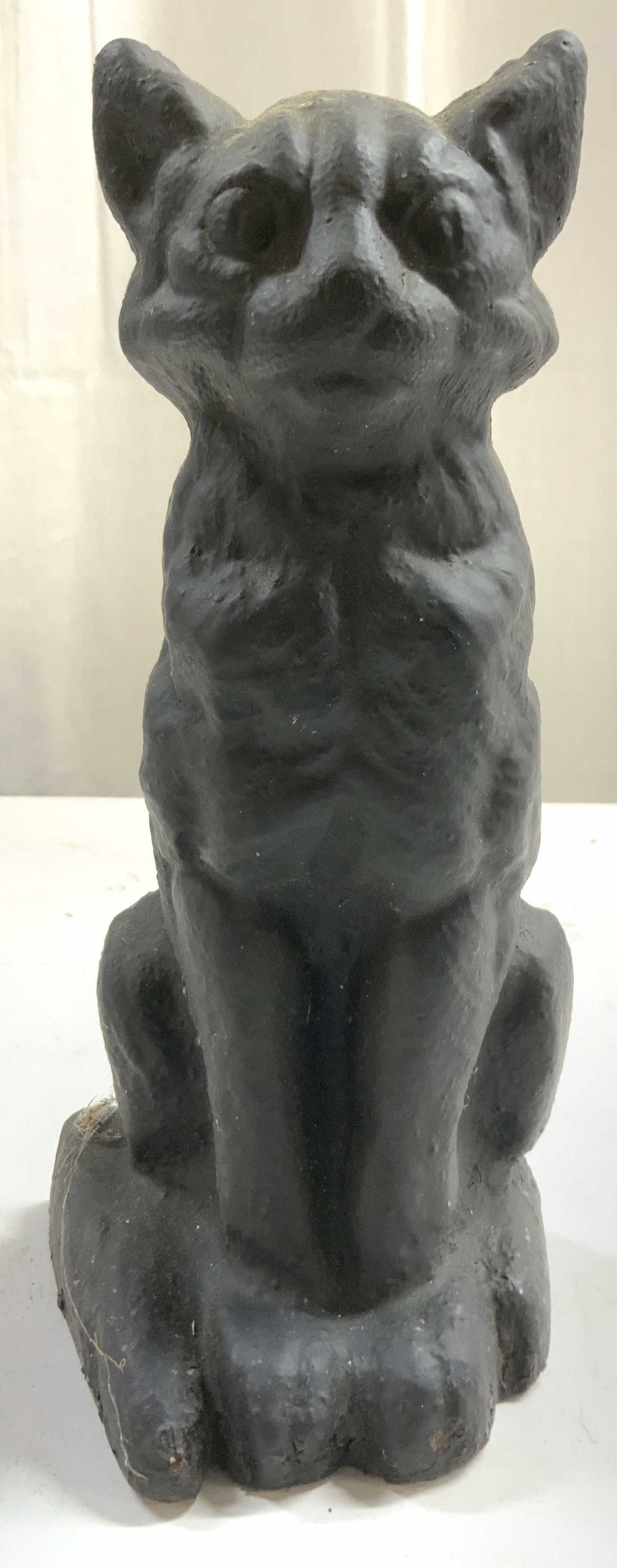 Antique Cast Iron Cat Door Stop Black: Door stop is antique. Piece is black toned and iron. Door stop depicts a seated cat figure. Piece has relief to show facial and fur detail. Door stop is significantly weighted for size. Piece measures