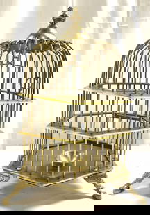 ETHAN ALLEN Footed Brass Birdcage: Tag on Underside reads ETHAN ALLEN. Birdcage is gold toned and brass. Interior has bowl & hanging perch. Piece has door. Cage has 3 feet. Base has hexagonal form. Top of cage resembles finial. Bird ca